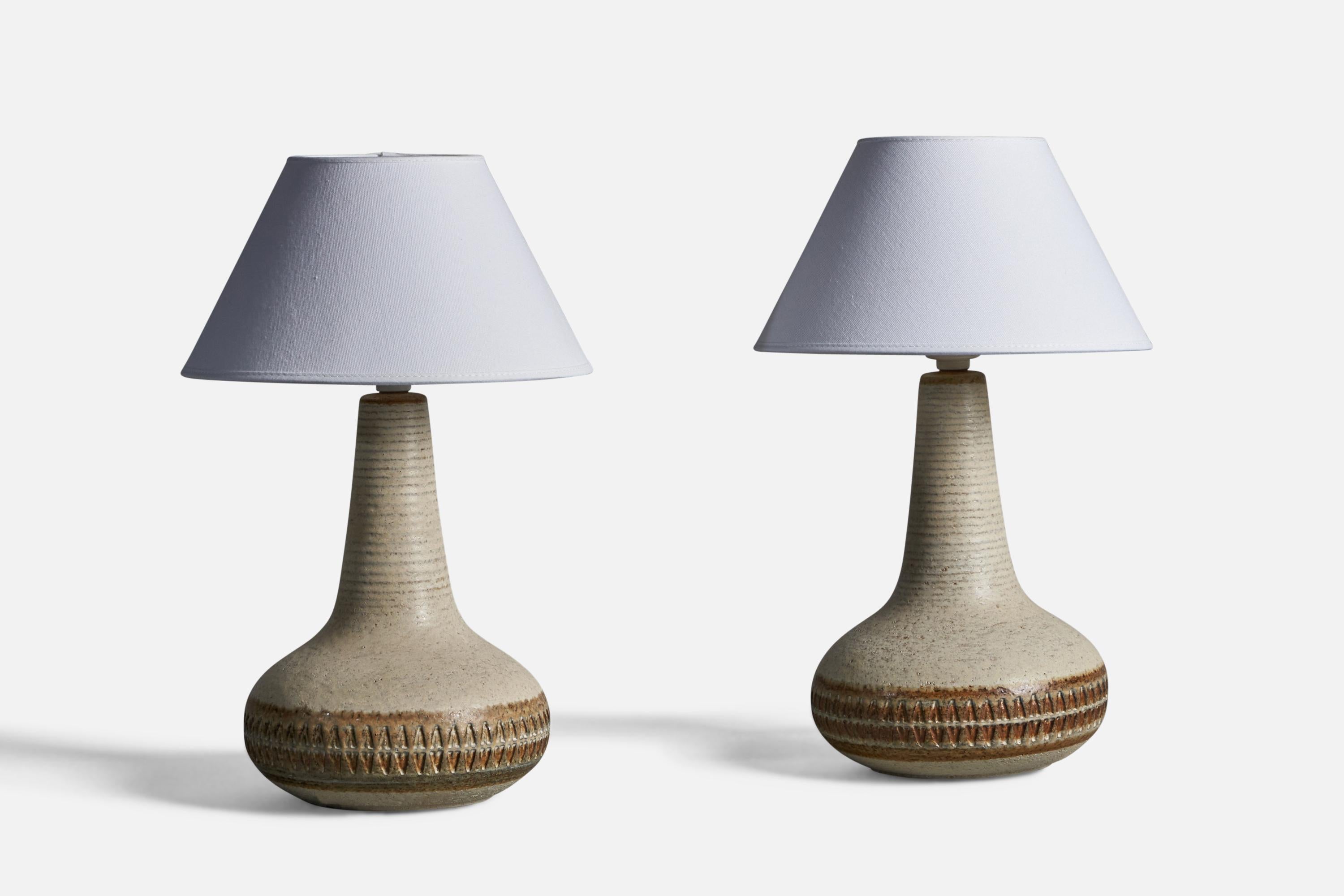 A pair of grey and brown glazed stoneware table lamps, designed and produced by 
Søholm, Bornholm, Denmark, 1960s.

Dimensions of Lamp (inches): 12.5