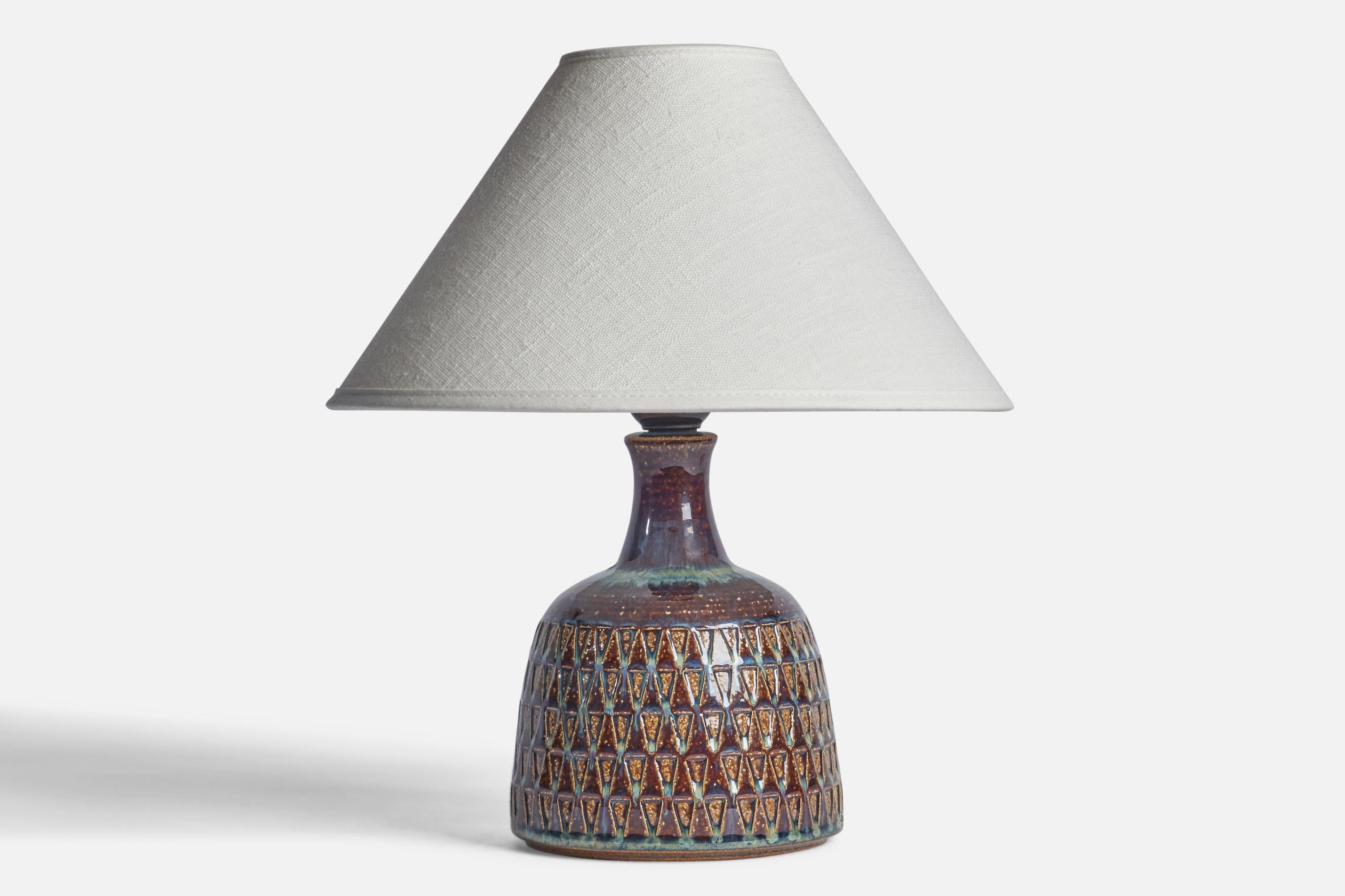 A blue and brown-glazed stoneware table lamp designed and produced by Søholm, Bornholm, Denmark, 1960s.

Dimensions of Lamp (inches): 8.5” H x 5” Diameter
Dimensions of Shade (inches): 2.5” Top Diameter x 10” Bottom Diameter x 5.5