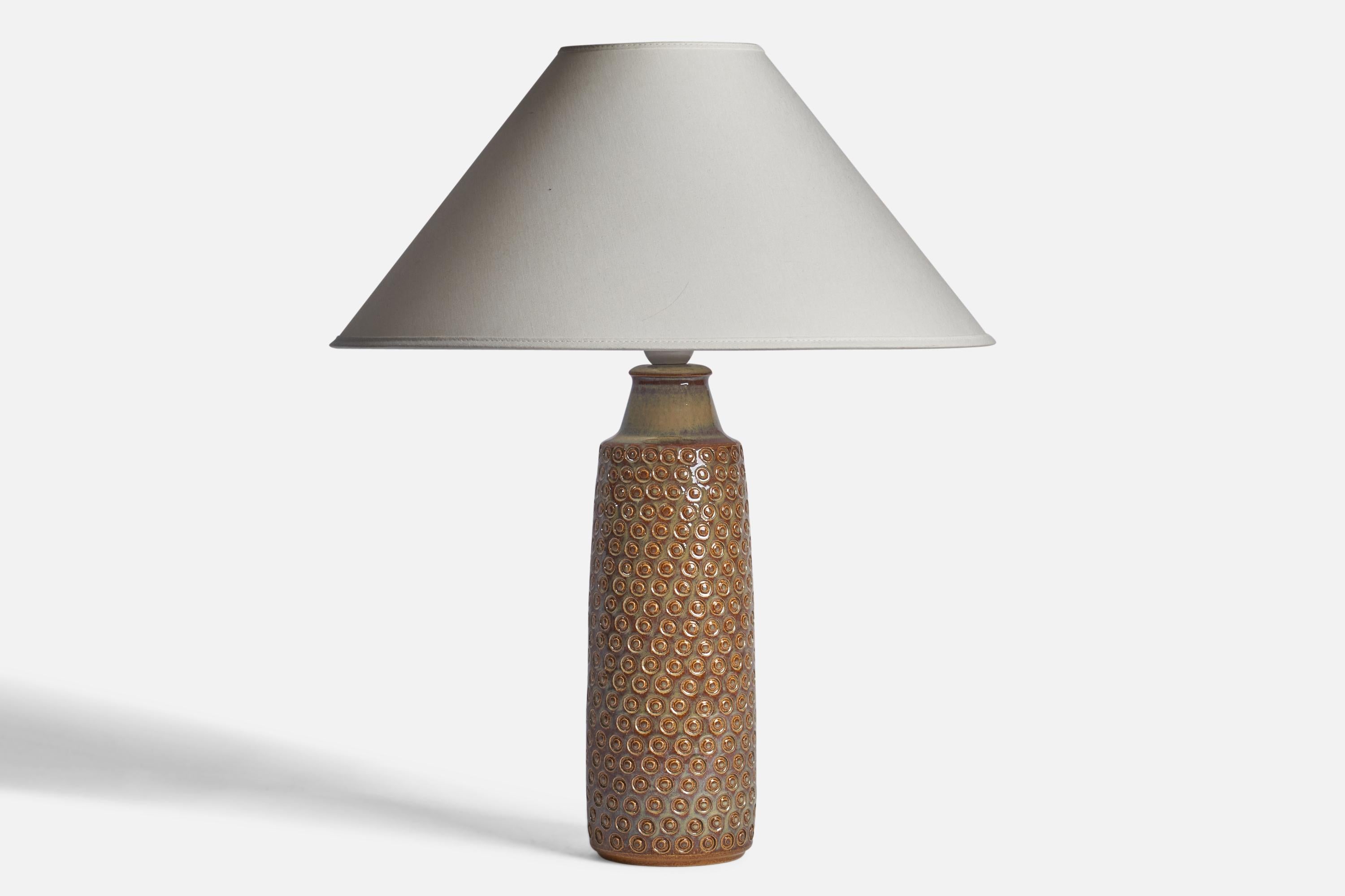A brown-glazed incised stoneware table lamp designed and produced by 
Søholm, Denmark, 1960s.

Dimensions of Lamp (inches): 14.85” H x 4” Diameter
Dimensions of Shade (inches): 4.5” Top Diameter x 16” Bottom Diameter x 7.25” H
Dimensions of Lamp