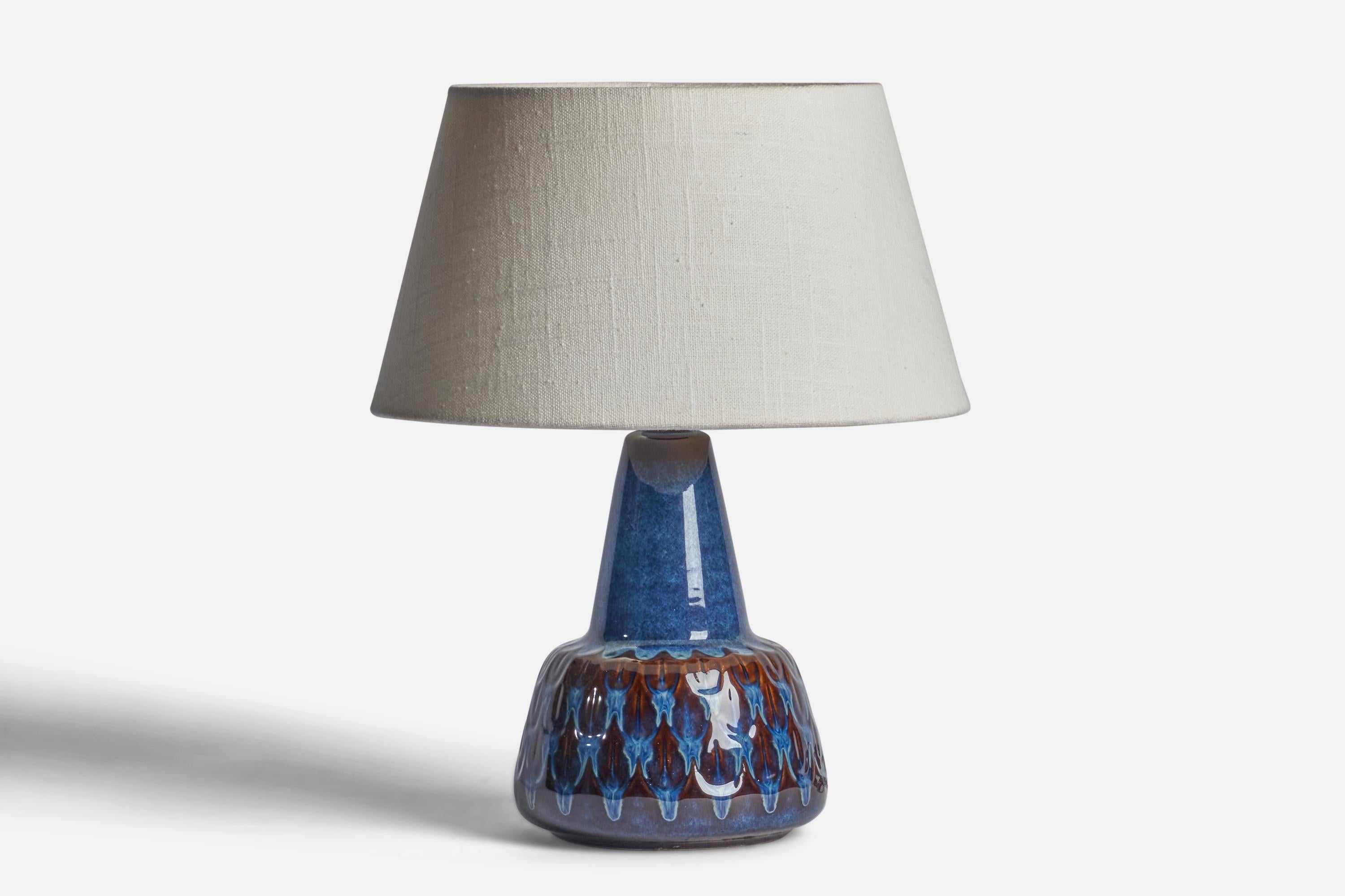 A blue-glazed stoneware table lamp designed and produced by Søholm, Bornholm, Denmark, 1960s.

Dimensions of Lamp (inches): 9.75” H x 5.75” Diameter
Dimensions of Shade (inches): 7” Top Diameter x 10” Bottom Diameter x 5.5” H 
Dimensions of Lamp