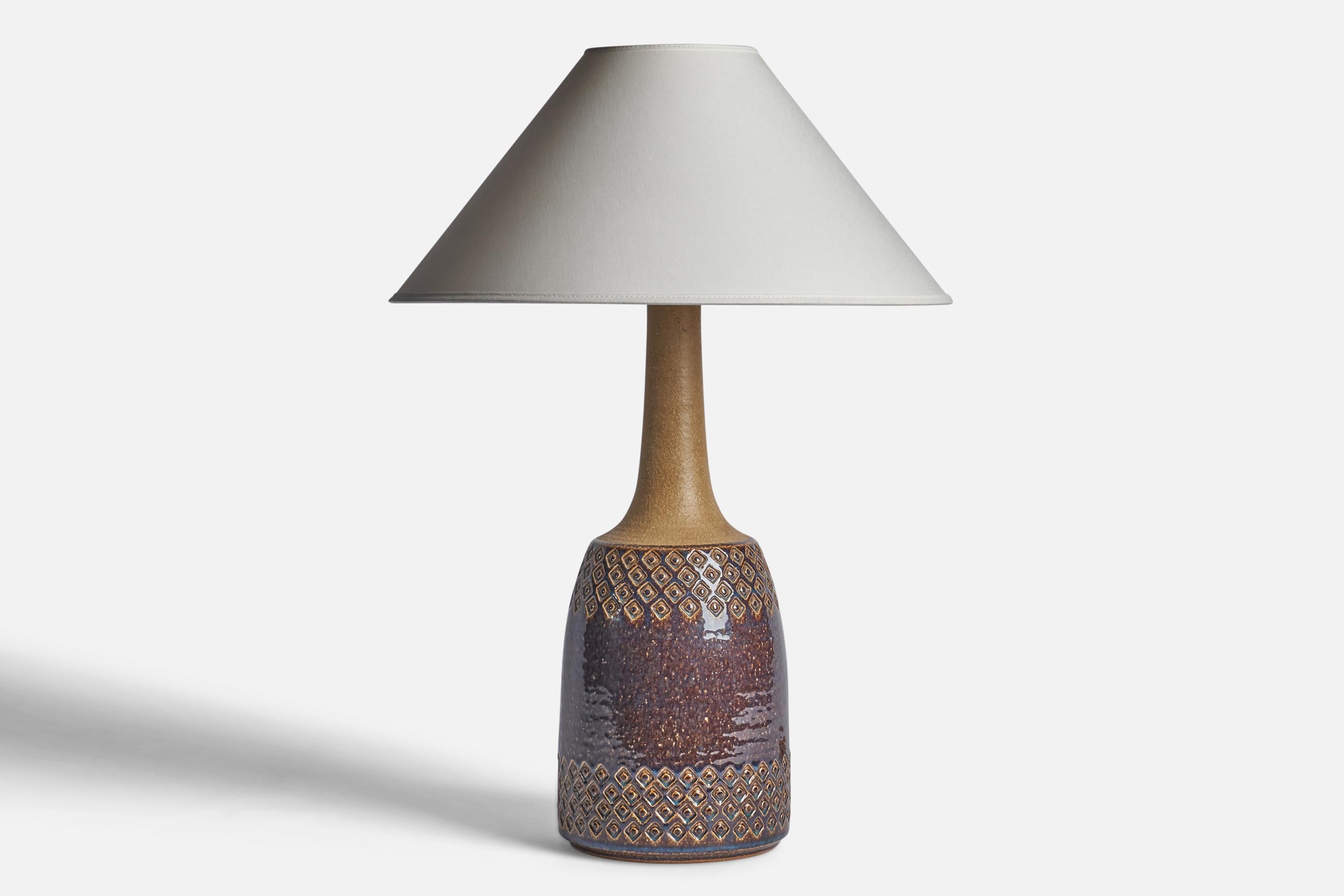 A brown and beige-glazed stoneware table lamp designed and produced by 
Søholm, Bornholm, Denmark, 1960s.

Dimensions of Lamp (inches): 18 H x 6.75” Diameter
Dimensions of Shade (inches): 4.5” Top Diameter x 16” Bottom Diameter x 7.25” H
Dimensions