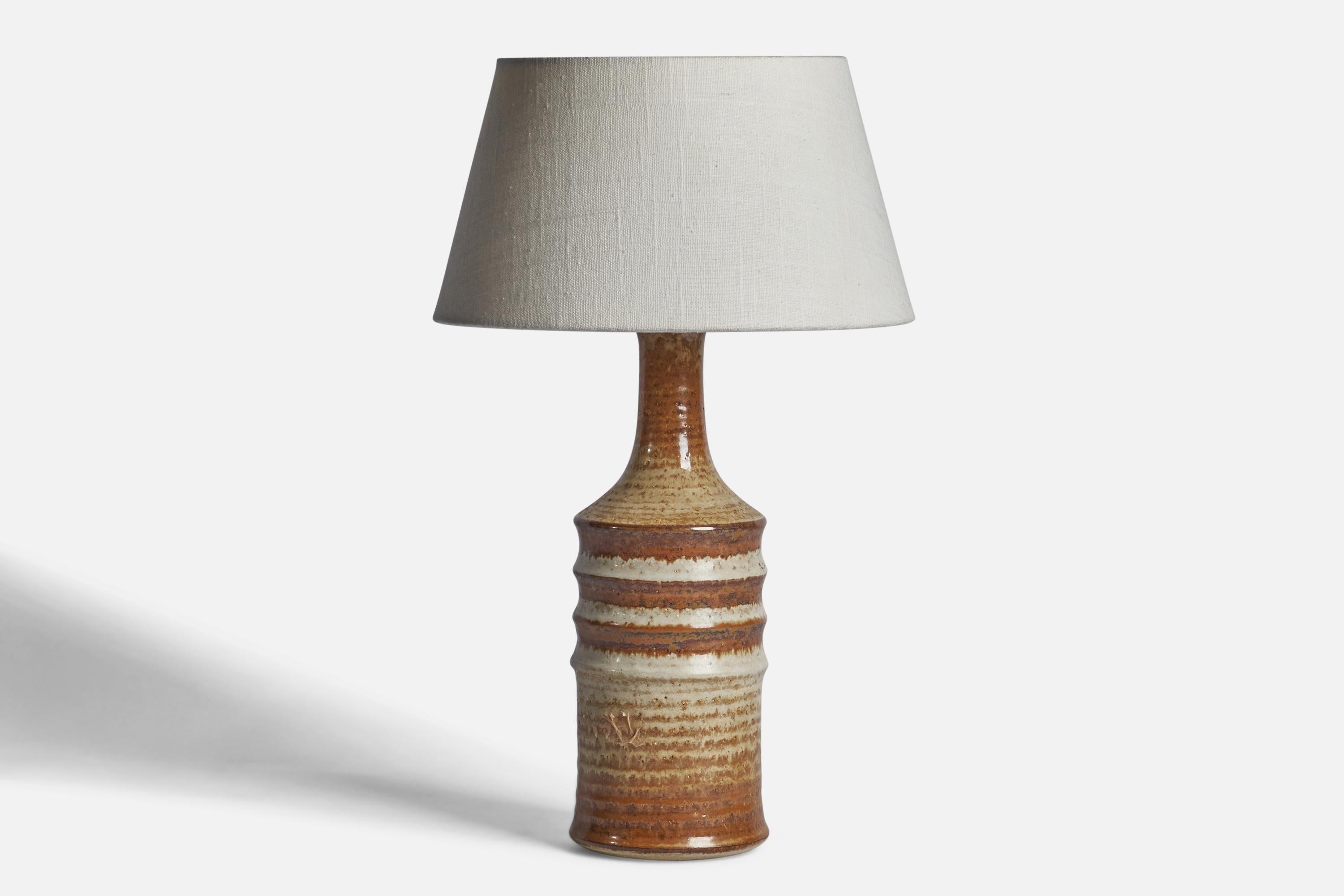 A brown and beige-glazed stoneware table lamp designed and produced by  Søholm, Denmark, 1960s.

Dimensions of Lamp (inches): 13.5” H x 4.25” Diameter
Dimensions of Shade (inches): 7” Top Diameter x 10” Bottom Diameter x 5.5” H 
Dimensions of Lamp