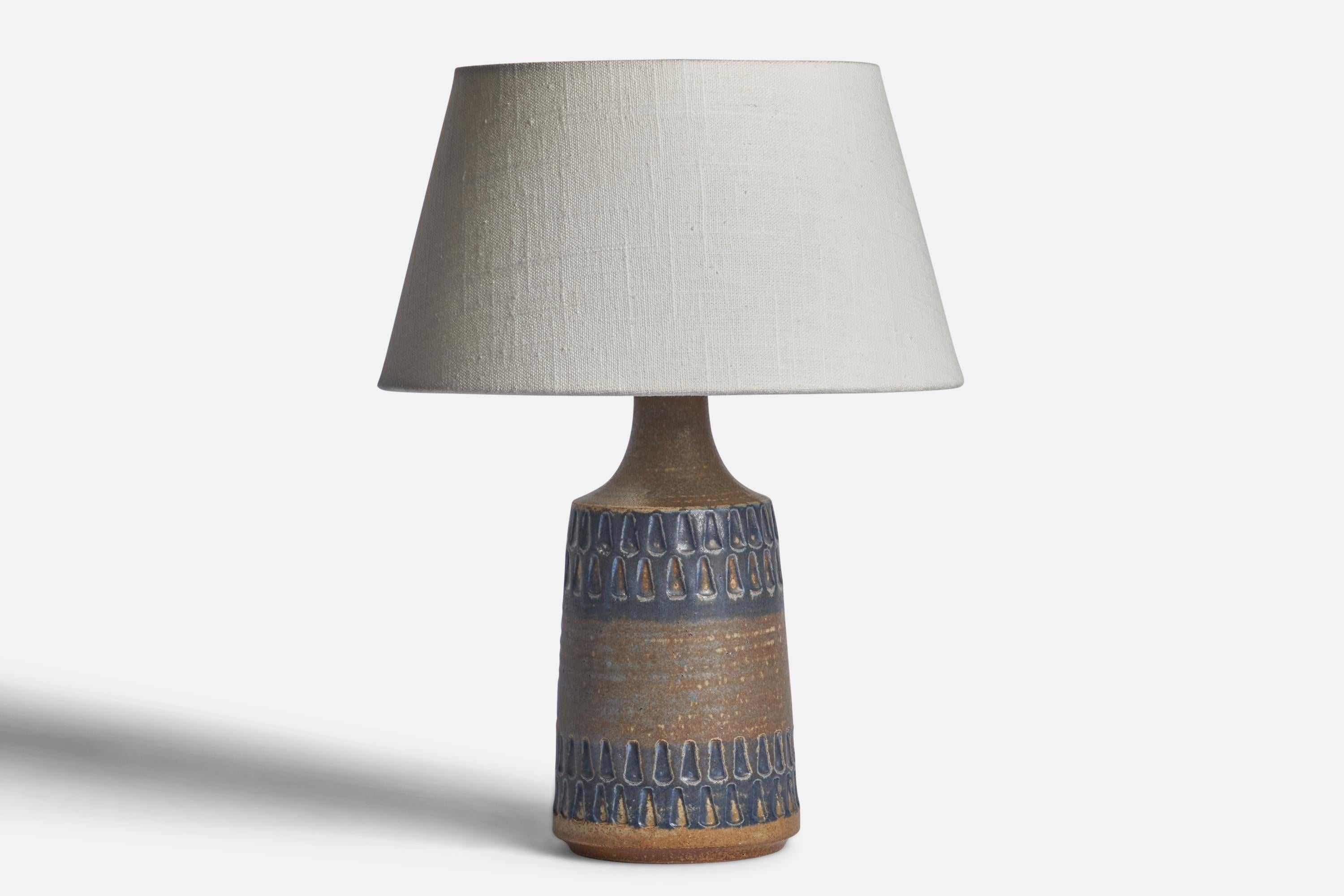 A blue and grey-glazed stoneware table lamp designed and produced by 
Søholm, Bornholm, Denmark, 1960s.

Dimensions of Lamp (inches): 10.5” H x 4.35” Diameter
Dimensions of Shade (inches): 7” Top Diameter x 10” Bottom Diameter x 5.5” H 
Dimensions