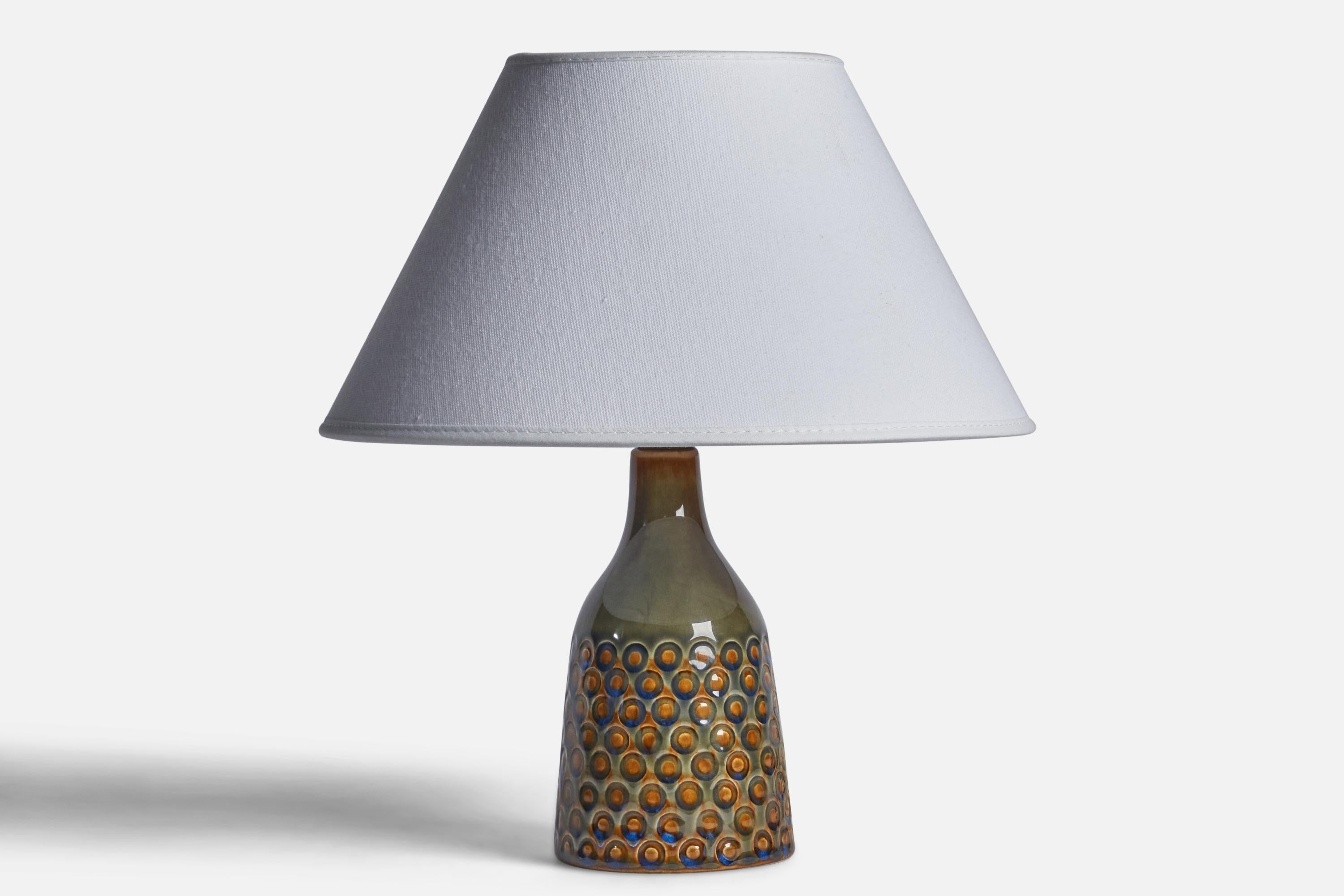 A green, blue and orange-glazed stoneware table lamp designed and produced by Søholm, Bornholm, Denmark, 1960s.

Dimensions of Lamp (inches): 8.25” H x 3.35” Diameter
Dimensions of Shade (inches): 7” Top Diameter x 10” Bottom Diameter x