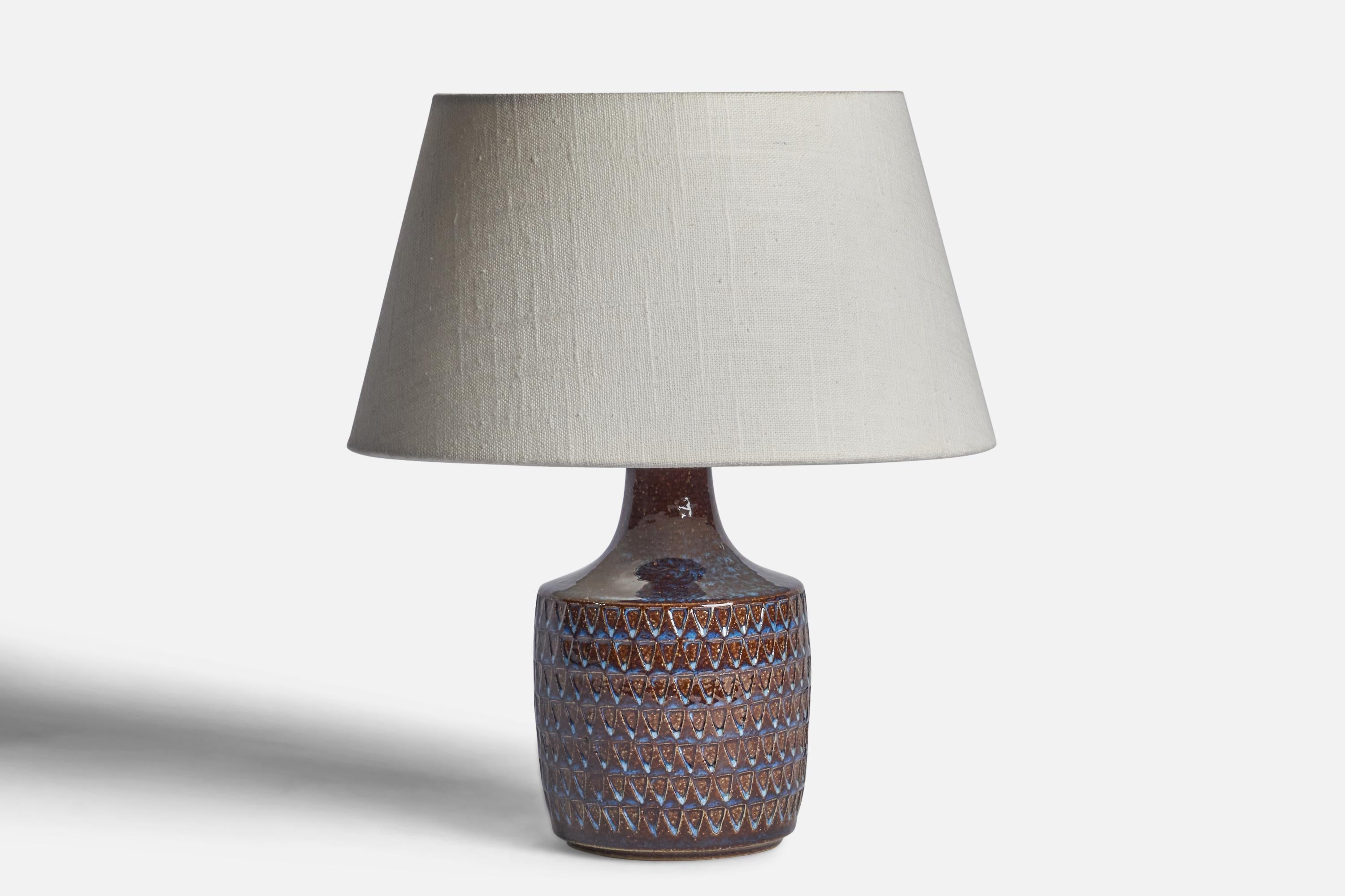 A blue and brown-glazed stoneware table lamp designed and produced by 
Søholm, Bornholm, Denmark, 1960s.

Dimensions of Lamp (inches): 8.65” H x 4.35” Diameter
Dimensions of Shade (inches): 7” Top Diameter x 10” Bottom Diameter x 5.5” H 
Dimensions