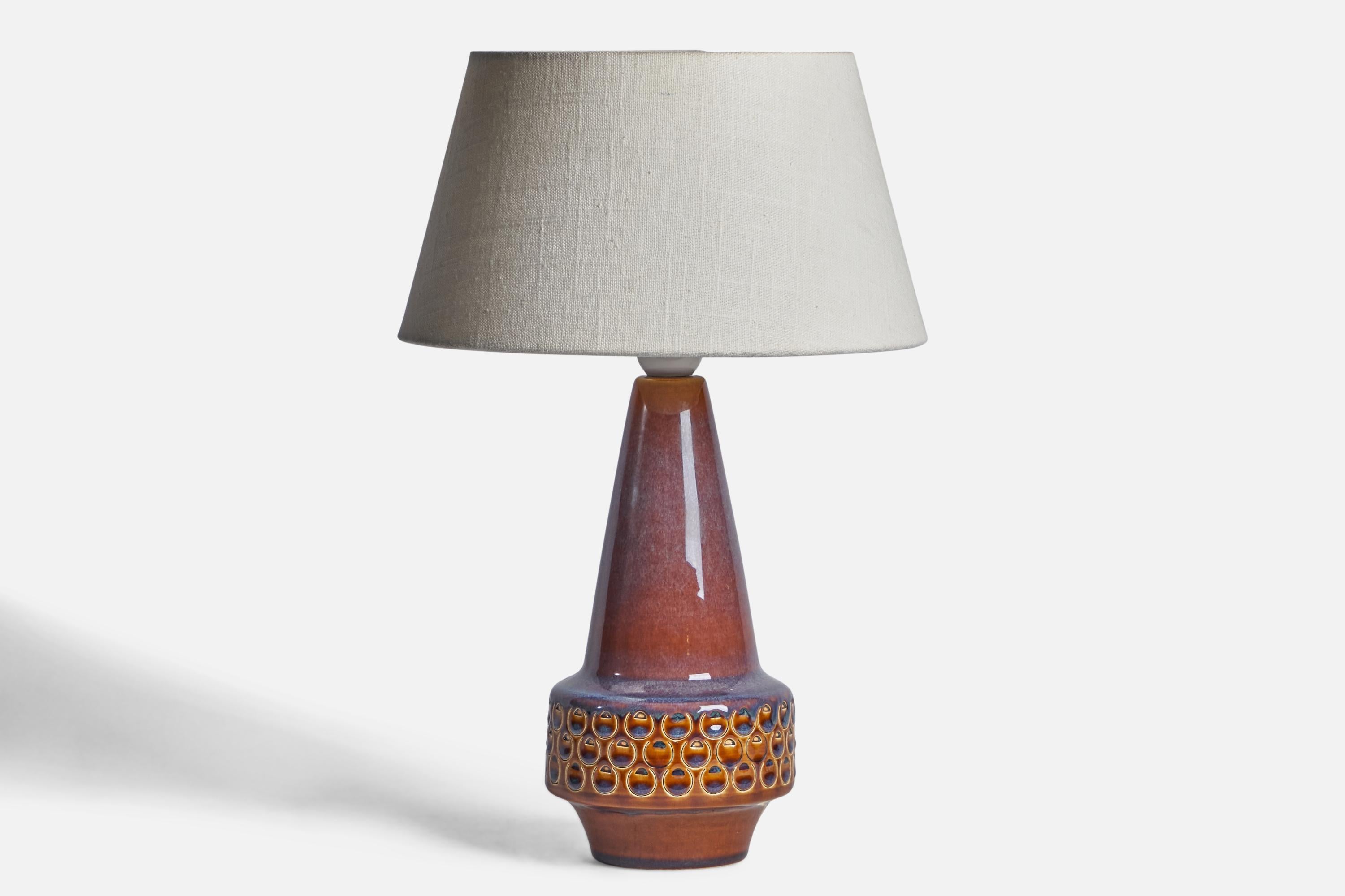 A blue red and beige-glazed stoneware table lamp designed and produced by Søholm, Denmark, 1960s.

Dimensions of Lamp (inches): 12.25” H x 4.75” Diameter
Dimensions of Shade (inches): 7” Top Diameter x 10” Bottom Diameter x 5.5” H 
Dimensions of