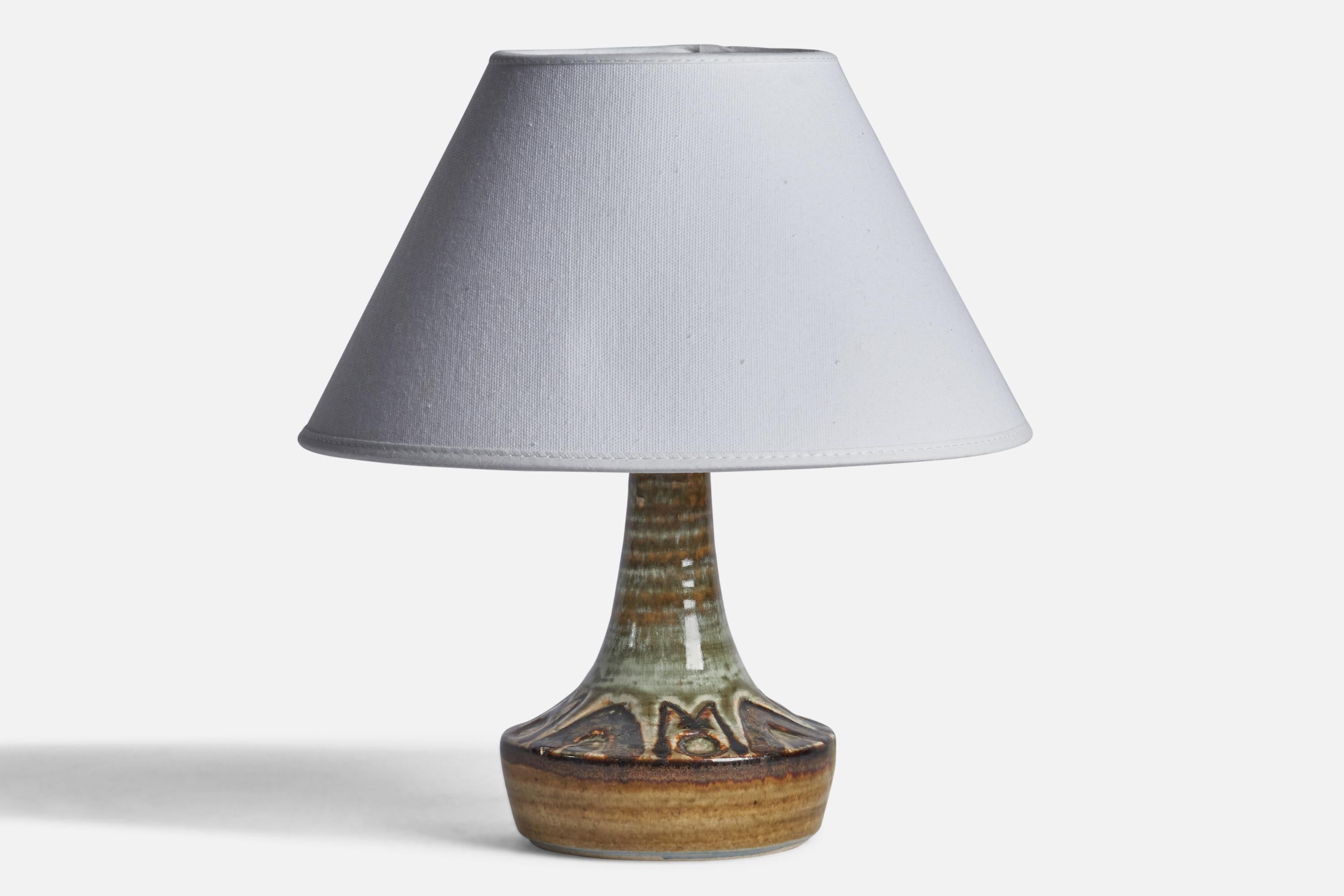 A green-glazed stoneware table lamp designed and produced by 
Søholm, Denmark, 1960s.

Dimensions of Lamp (inches): 8” H x 4.75” Diameter
Dimensions of Shade (inches): 4.5” Top Diameter x 9.75” Bottom Diameter x 5.8” H
Dimensions of Lamp with Shade