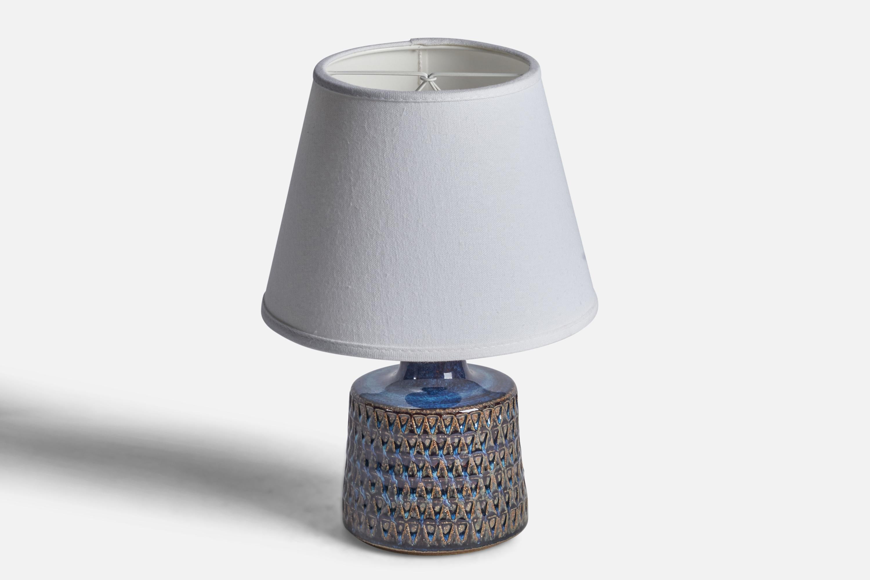A blue and brown-glazed incised stoneware table lamp designed and produced by Søholm, Denmark, 1960s.

Dimensions of Lamp (inches): 9” H x 4.75” Diameter
Dimensions of Shade (inches): 5” Top Diameter x 8” Bottom Diameter x 6” H 
Dimensions of Lamp