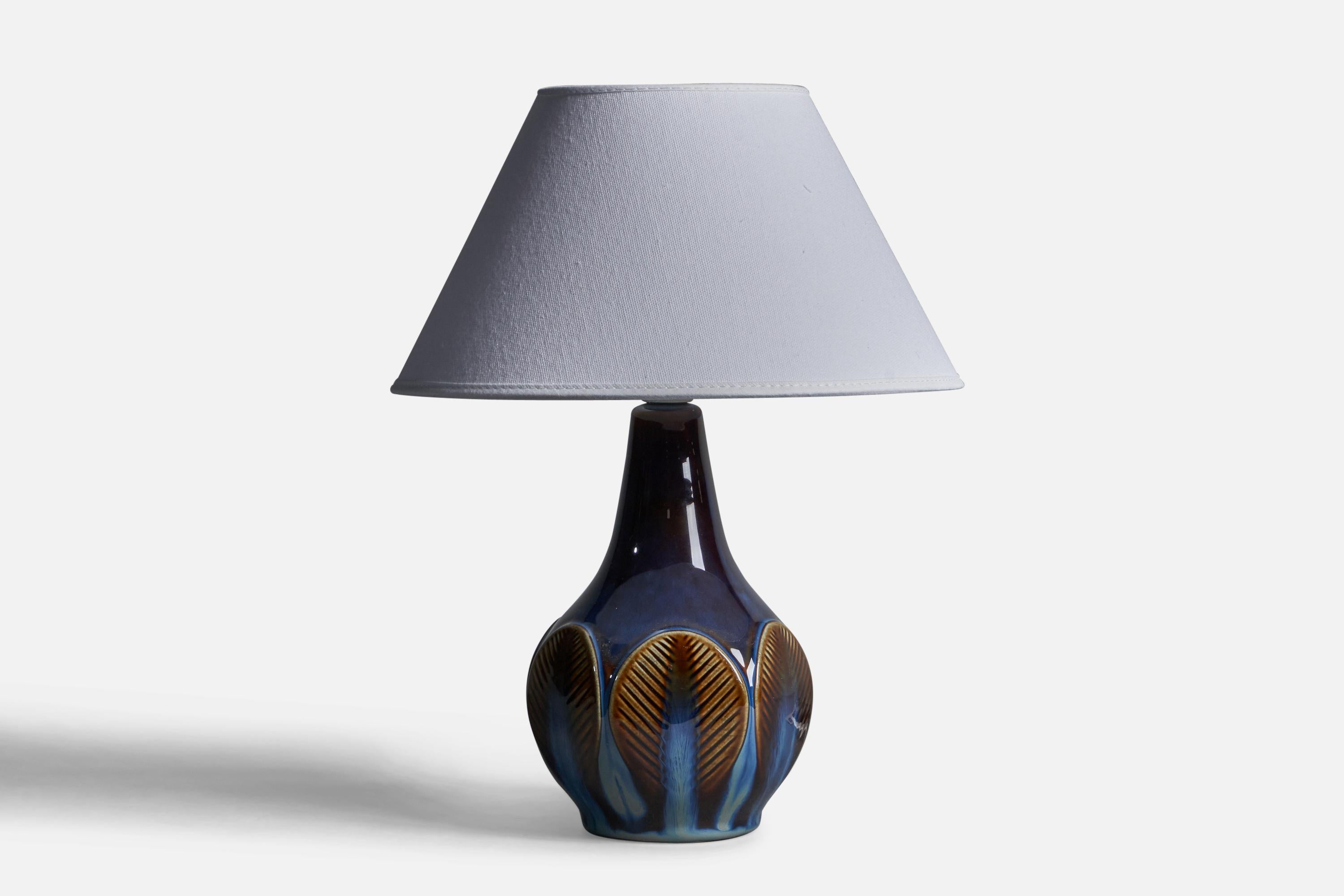 A blue-glazed stoneware table lamp designed and produced by 
Søholm, Bornholm, Denmark, 1960s.

Dimensions of Lamp (inches): 10