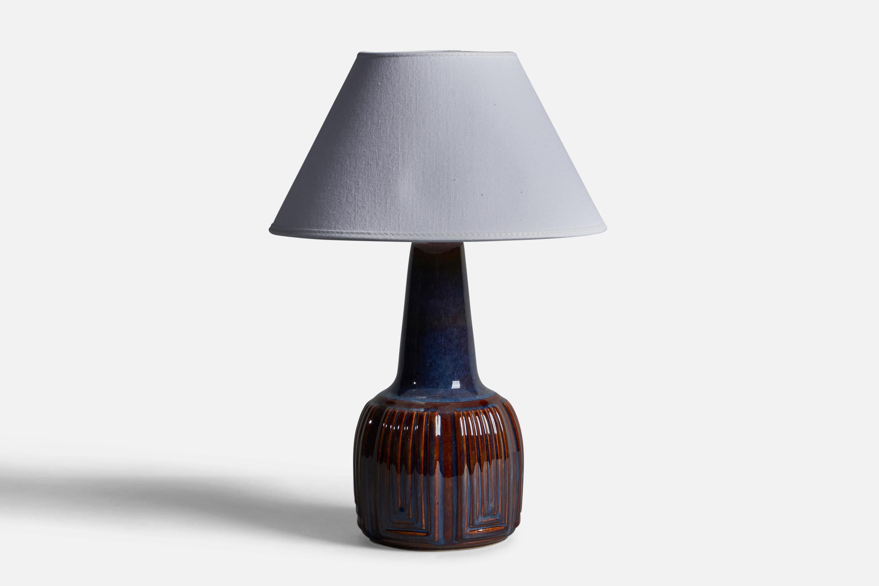 A blue-glazed stoneware table lamp designed and produced by  Søholm, Bornholm, Denmark, 1960s.

Dimensions of Lamp (inches): 11.5