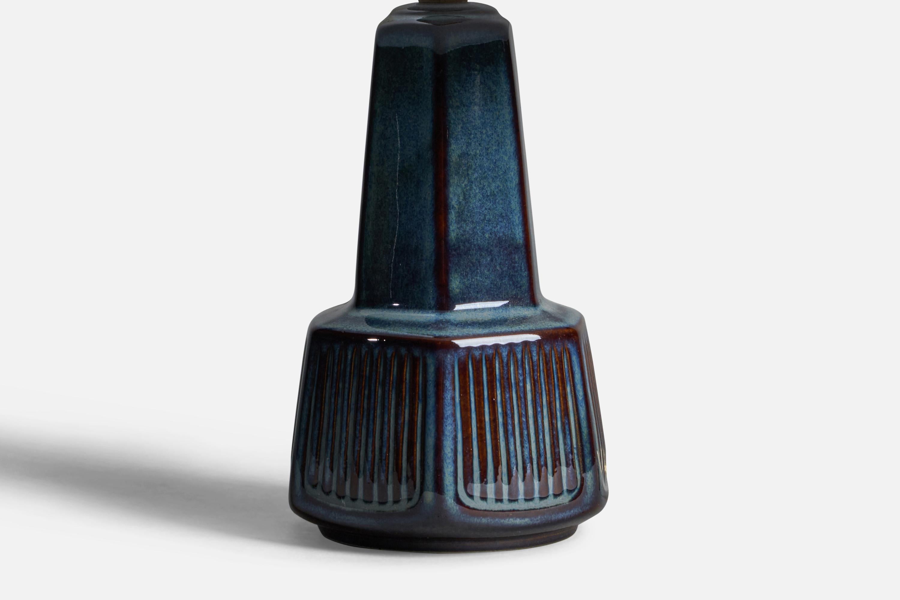 A blue-glazed stoneware table lamp designed and produced by  Søholm, Bornholm, Denmark, 1960s.

Dimensions of Lamp (inches): 10