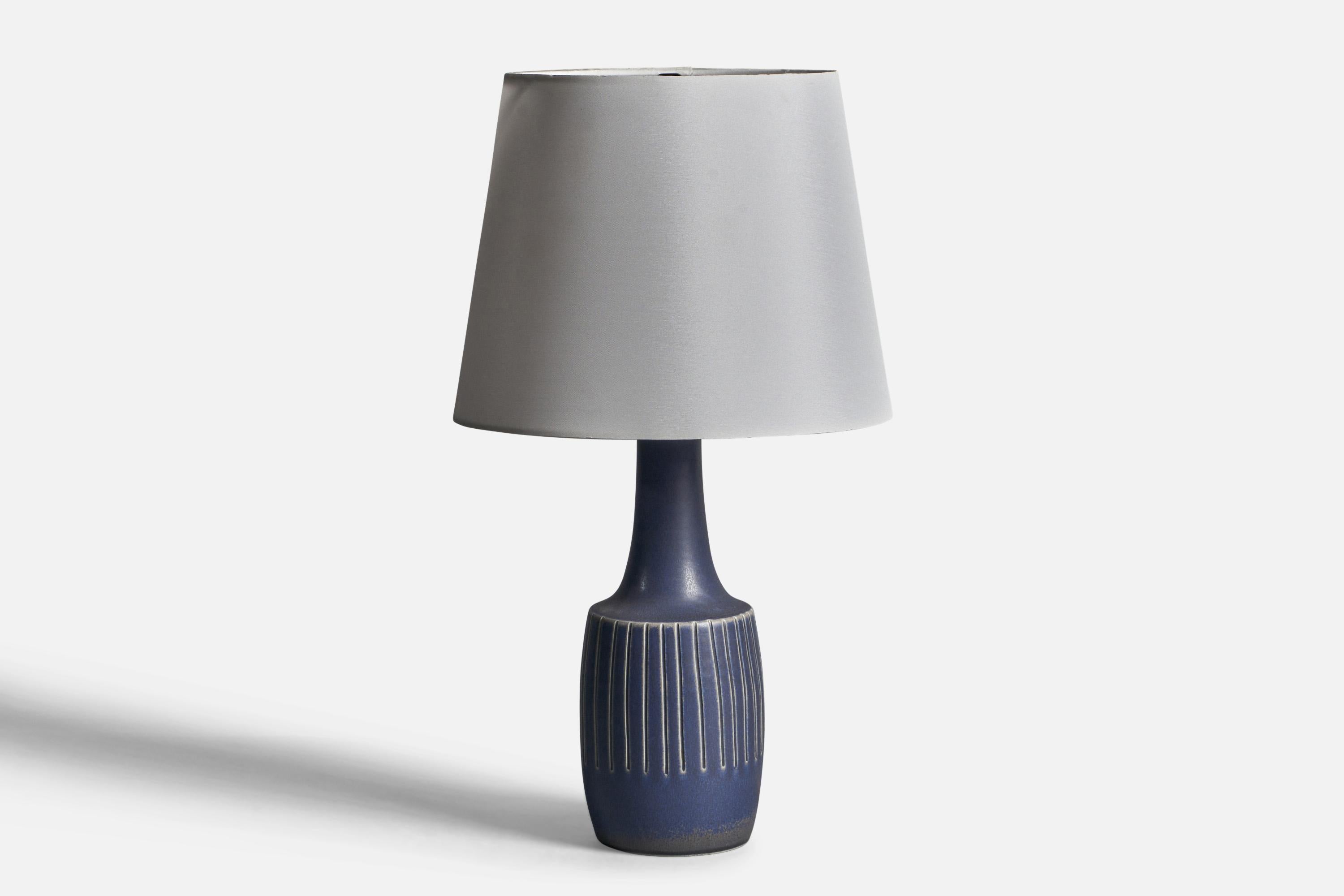 A blue-glazed stoneware table lamp designed and produced by  Søholm, Bornholm, Denmark, 1960s.

Dimensions of Lamp (inches): 13