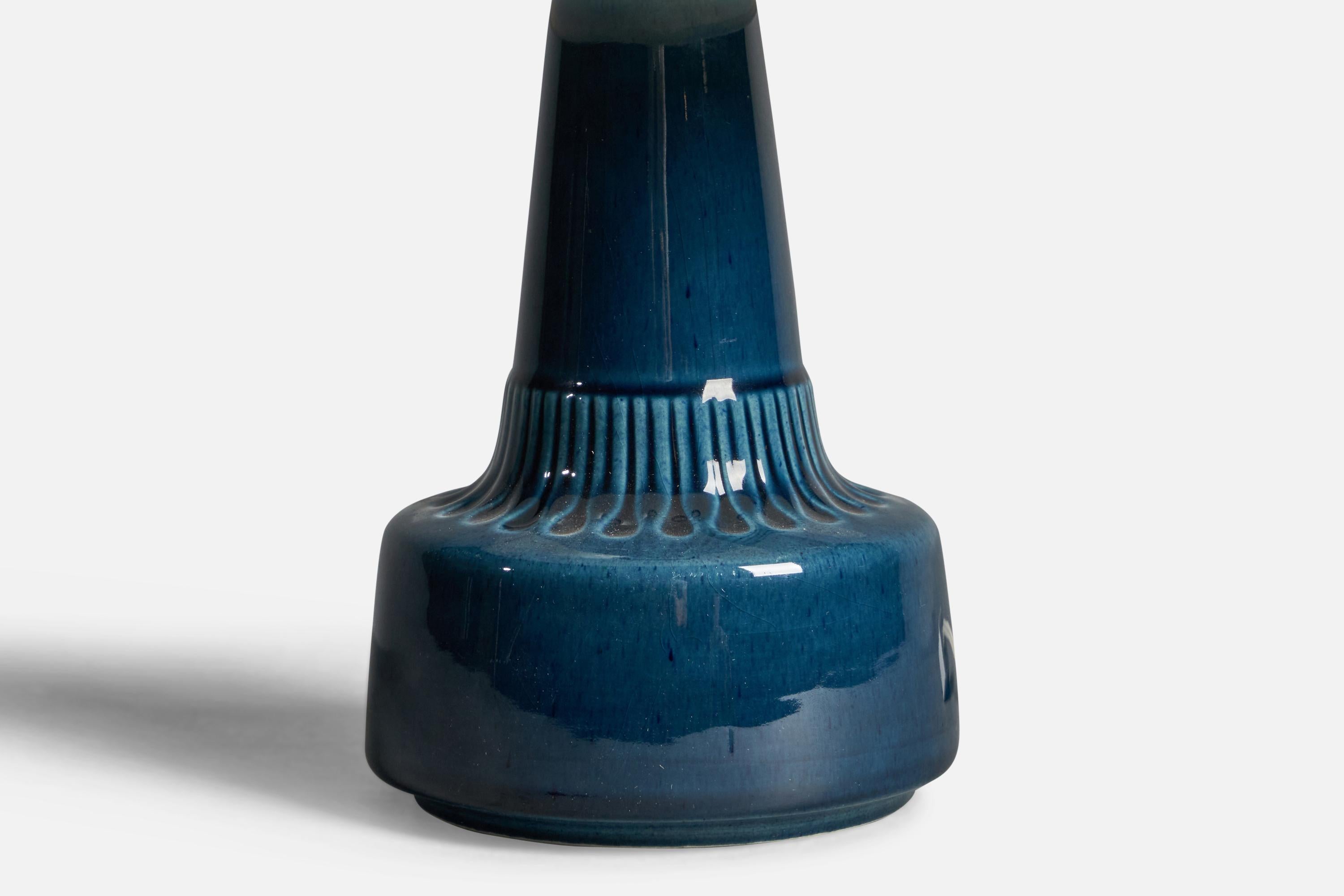 A blue-glazed stoneware table lamp designed and produced by  Søholm, Bornholm, Denmark, 1960s.

Dimensions of Lamp (inches): 9