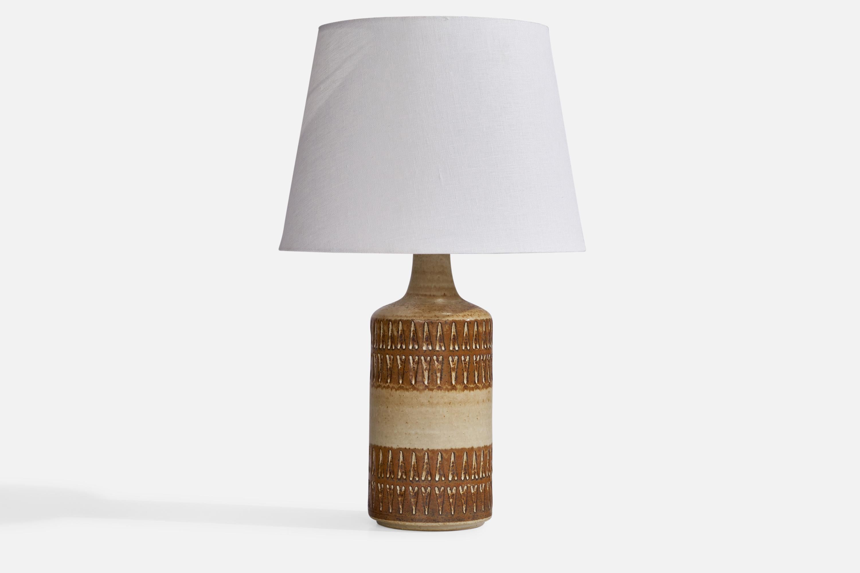 A brown and beige-glazed stoneware table lamp designed and produced by Søholm, Denmark, 1960s.
 
Dimensions of Lamp (inches): 14.2” H x 4.9