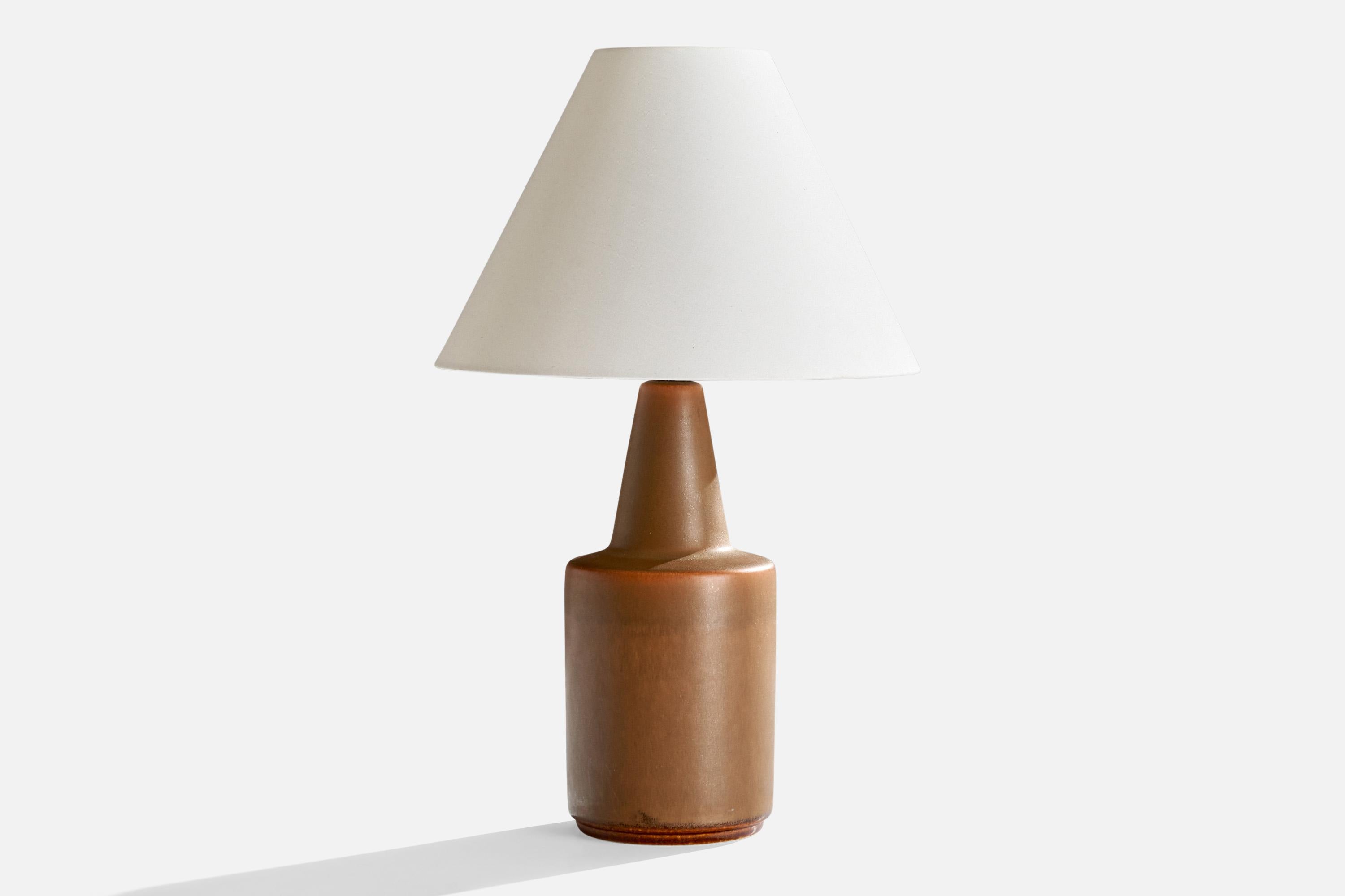 A brown-glazed stoneware table lamp produced by Søholm, Denmark, 1960s.

Dimensions of Lamp (inches): 9.5” H x 4.125” W x 4.125” D
Dimensions of Shade (inches): 3.5” Top Diameter x 10” Bottom Diameter x 7.25” H

Dimensions of Lamp with Shade