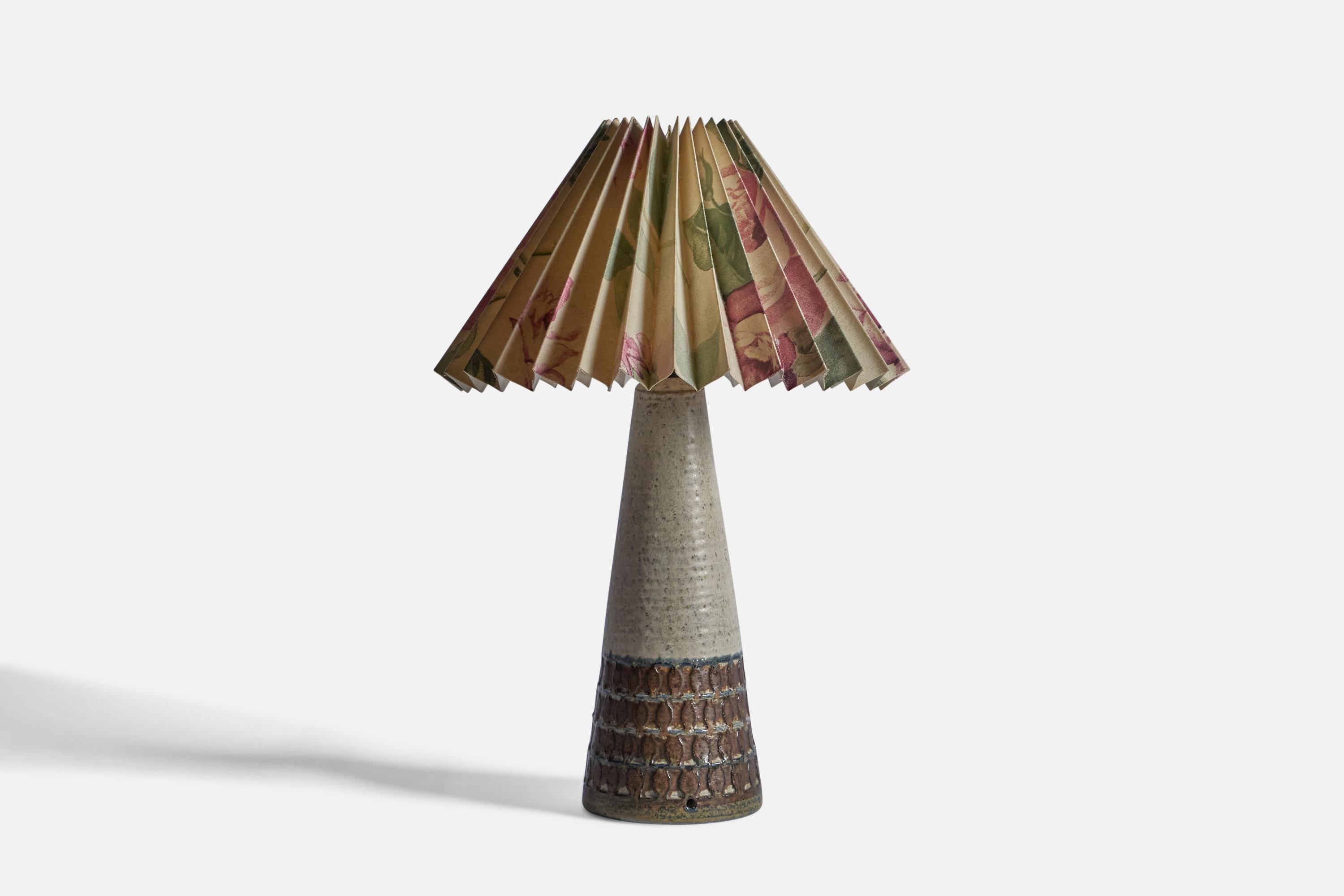 A white and brown-glazed stoneware and printed floral paper table lamp, designed and produced by Søholm, Bornholm, Denmark, c. 1960s.

Sold with Lampshade

Dimensions stated are of Table Lamp with Lampshade.