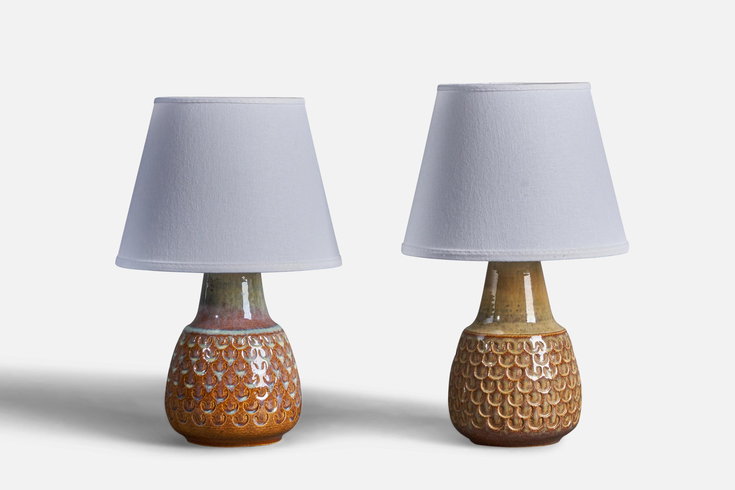 A set of two brown blue and beige-glazed stoneware table lamps, designed and produced by Søholm, Bornholm, Denmark, c. 1960s.
Dimensions of Lamp (inches): 9.75” H x 4.75” Diameter
Dimensions of Shade (inches): 5” Top Diameter x 8” Bottom Diameter x