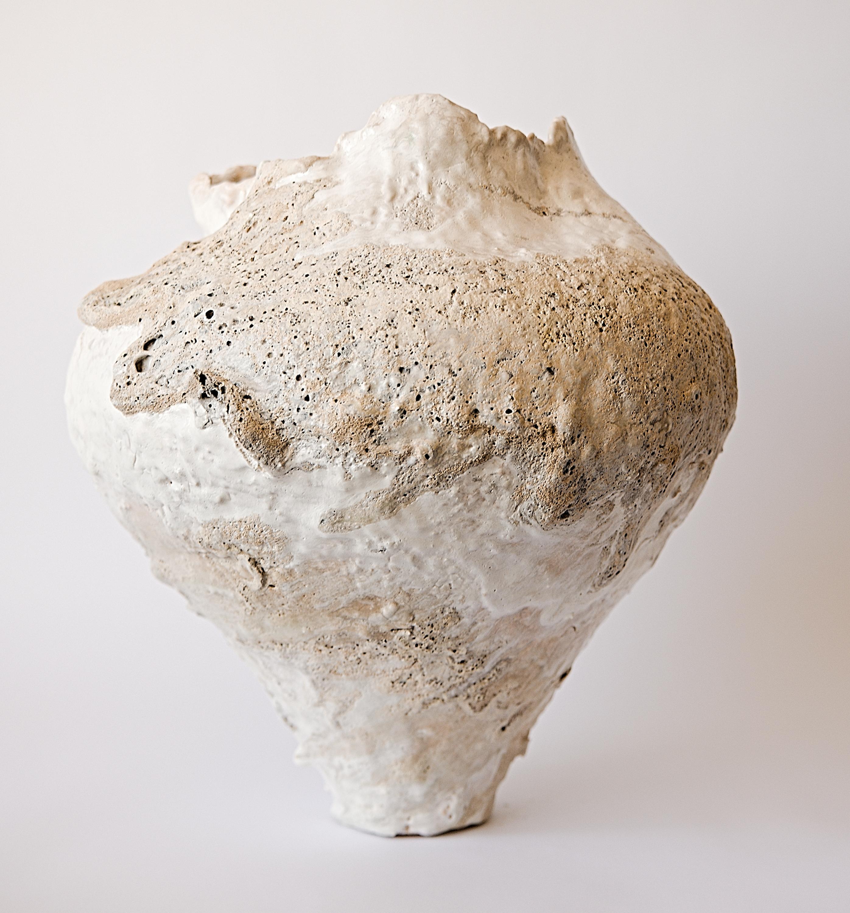
Torn edges, cream and white matt and and texture glazes 

 
Each piece is hand coiled stoneware clay. Fired multiple times and ways to create One of Kind Vessel.covered in custom slips, Oxides and glazes perfect for a coastal home or home with a