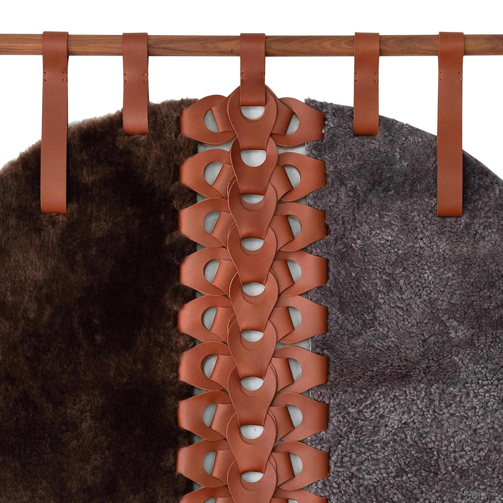 The Vertebrae Pill Tapestry X is the pill; shaped variation of our Vertebrae Tapestry X! It brings an organic vibe to the walls of any room. 
Designed with shearling panels (colors: Chocolate Pared Shearling on reft, Stone Surly Shearling on right),