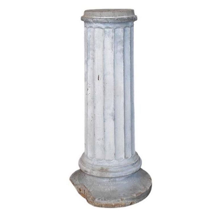 A short architectural rustic Corinthian concrete column. Created from concrete, this small column will be a great accent to a patio perhaps with a concrete bust placed atop. It is round, and features a round base, with a rustic look.