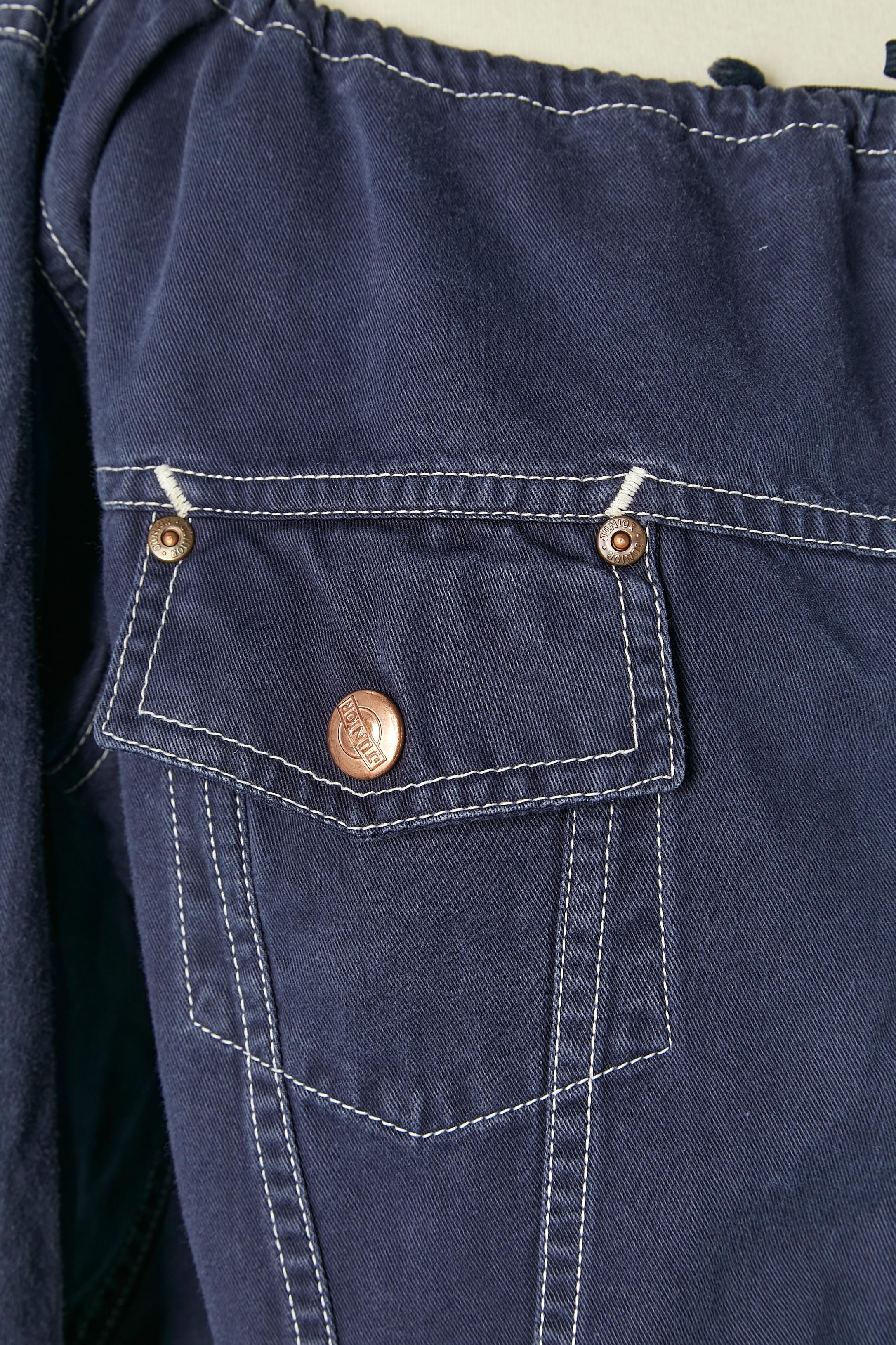 Short blue cotton jacket with drawstring on the neckline, bottom edge and sleeve edge . Branded button and buttonhole closure on the the middle front and on the pocket. Branded studs. Top-stitched. 
SIZE 42 (It) 38 (Fr) M 