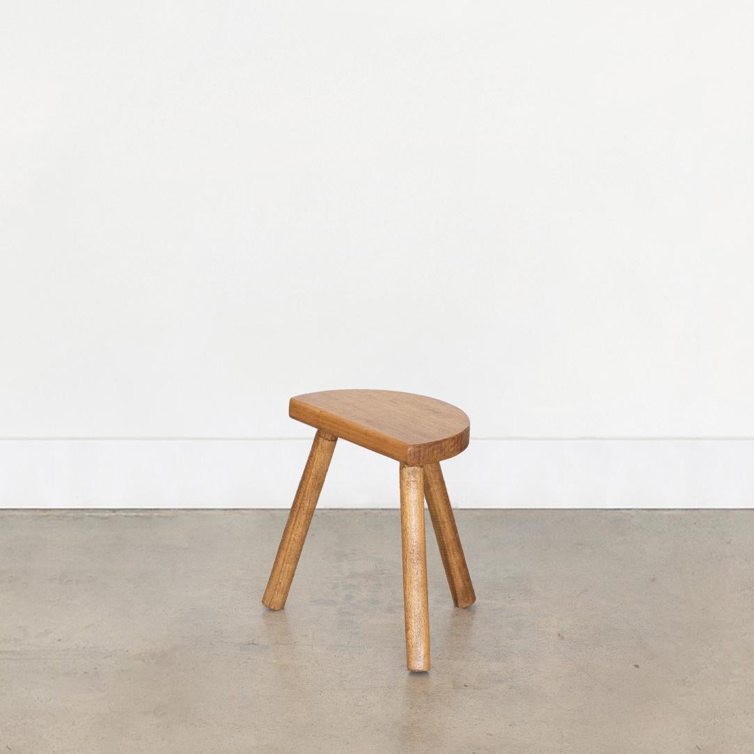 Vintage short stool with semi-circle seat and tripod legs from France. Original light oak finish with great age markings and patina. Can be used as a stool or as side table next to chairs.

 