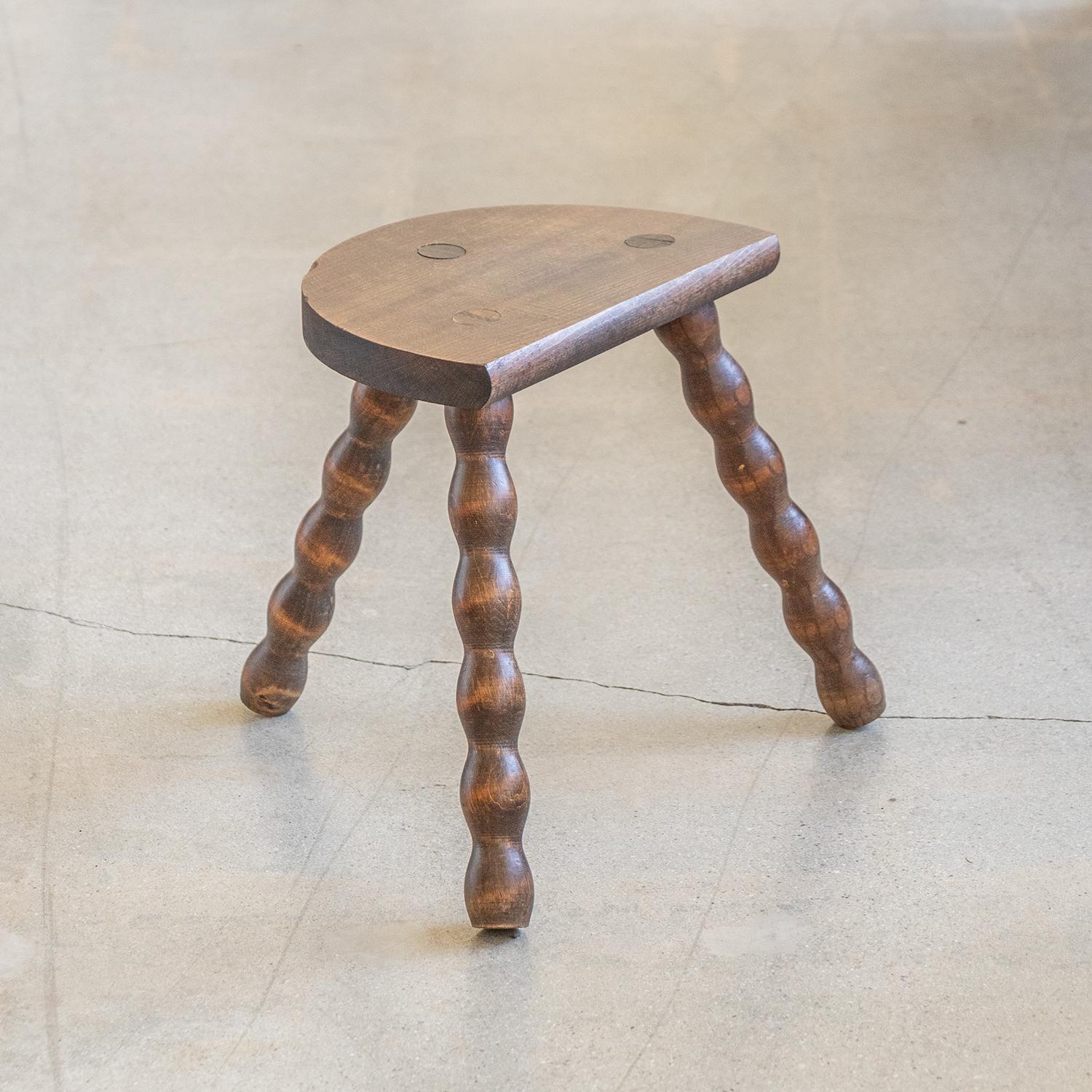 Vintage short stool with semi-circle seat and beautiful wavy legs from France. Original finish with great age markings and patina. Can be used as a stool or as side table next to chairs.