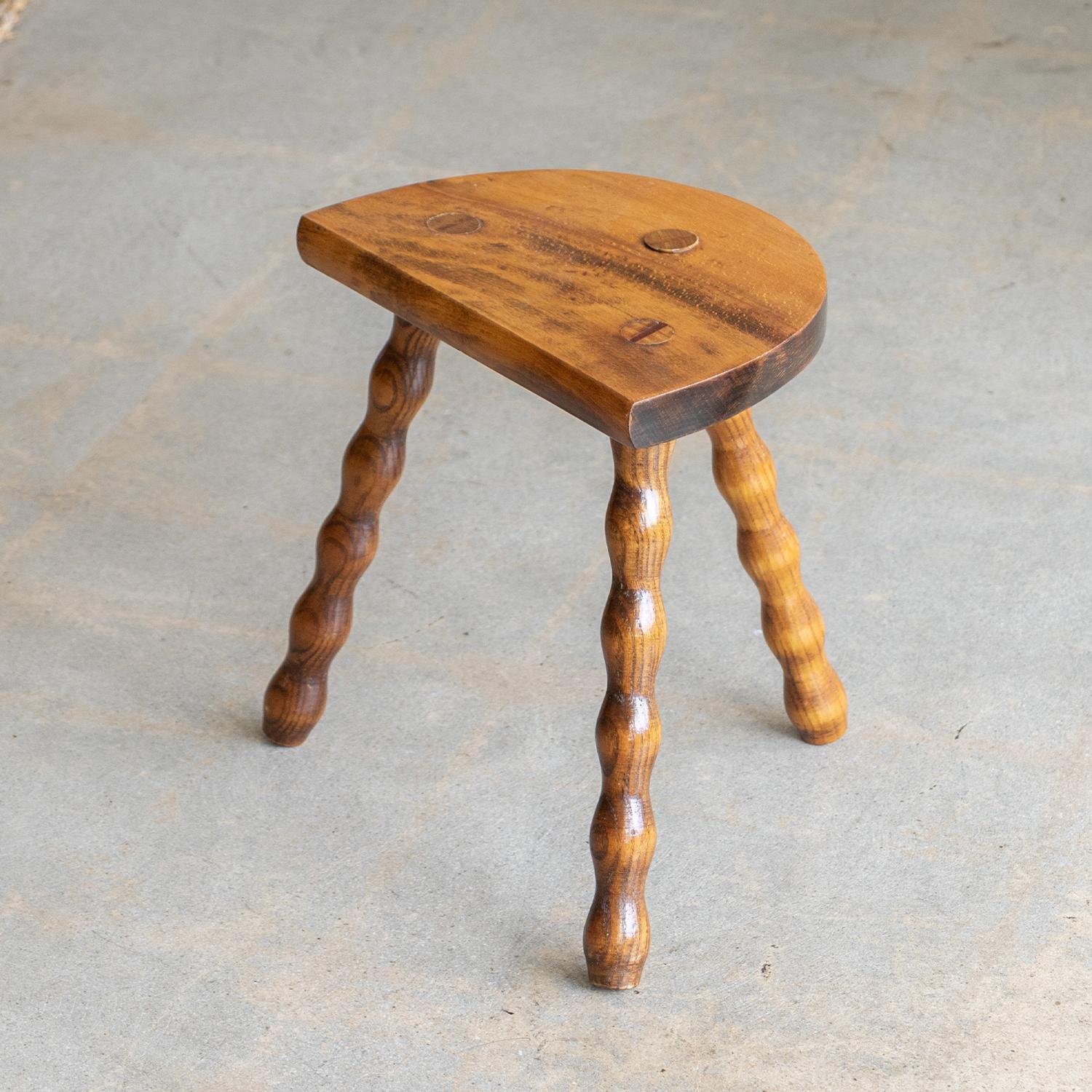 Vintage short stool with semi-circle seat and beautiful wavy legs from France. Original finish with great age markings and patina. Can be used as a stool or as side table next to chairs.
