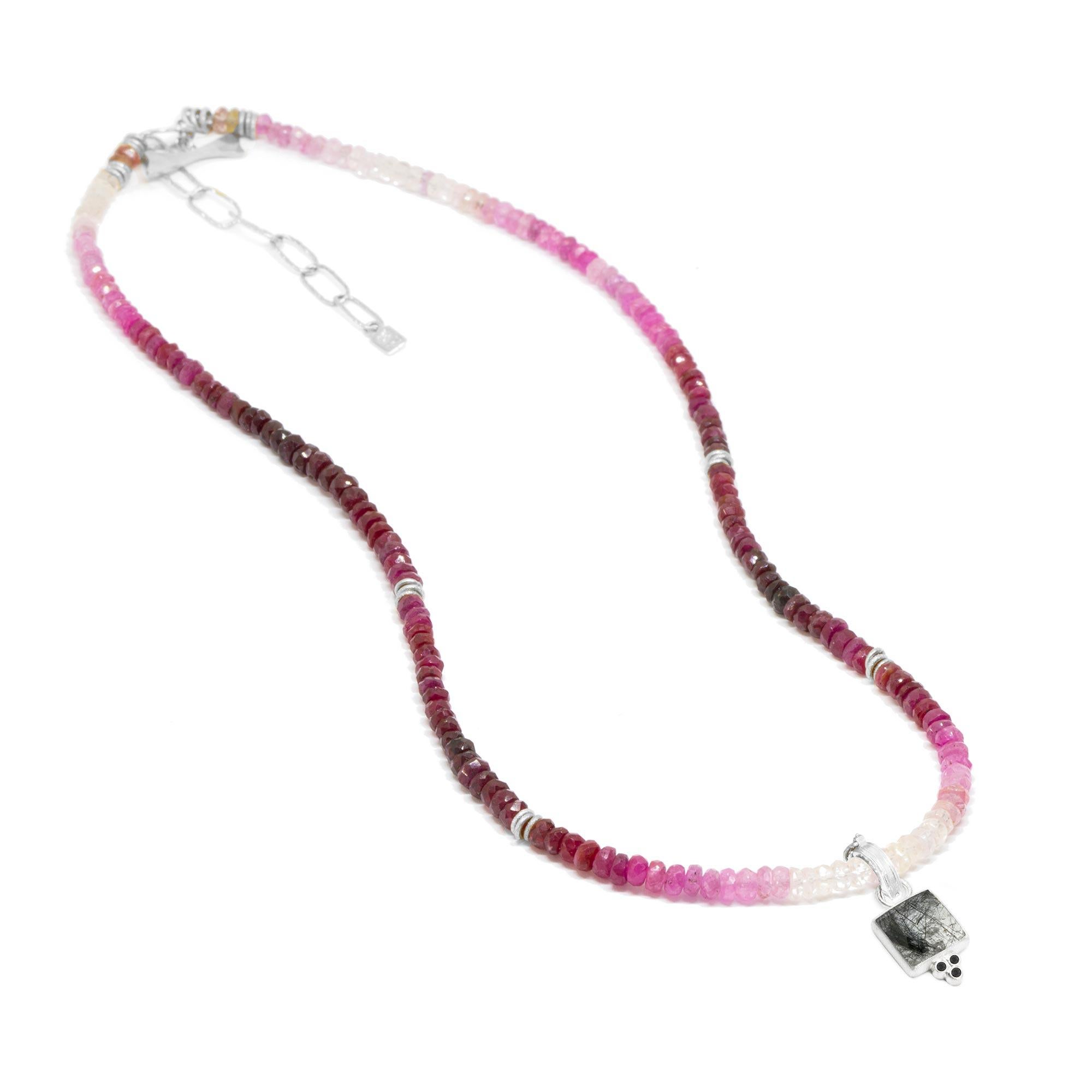 The best part about the Short Heritage Silver Necklette isn’t just that it can be worn long, doubled-up, or as a wrap bracelet (although that’s pretty cool). It’s that you can thread any of our Charms onto the ruby beads—have fun playing with all
