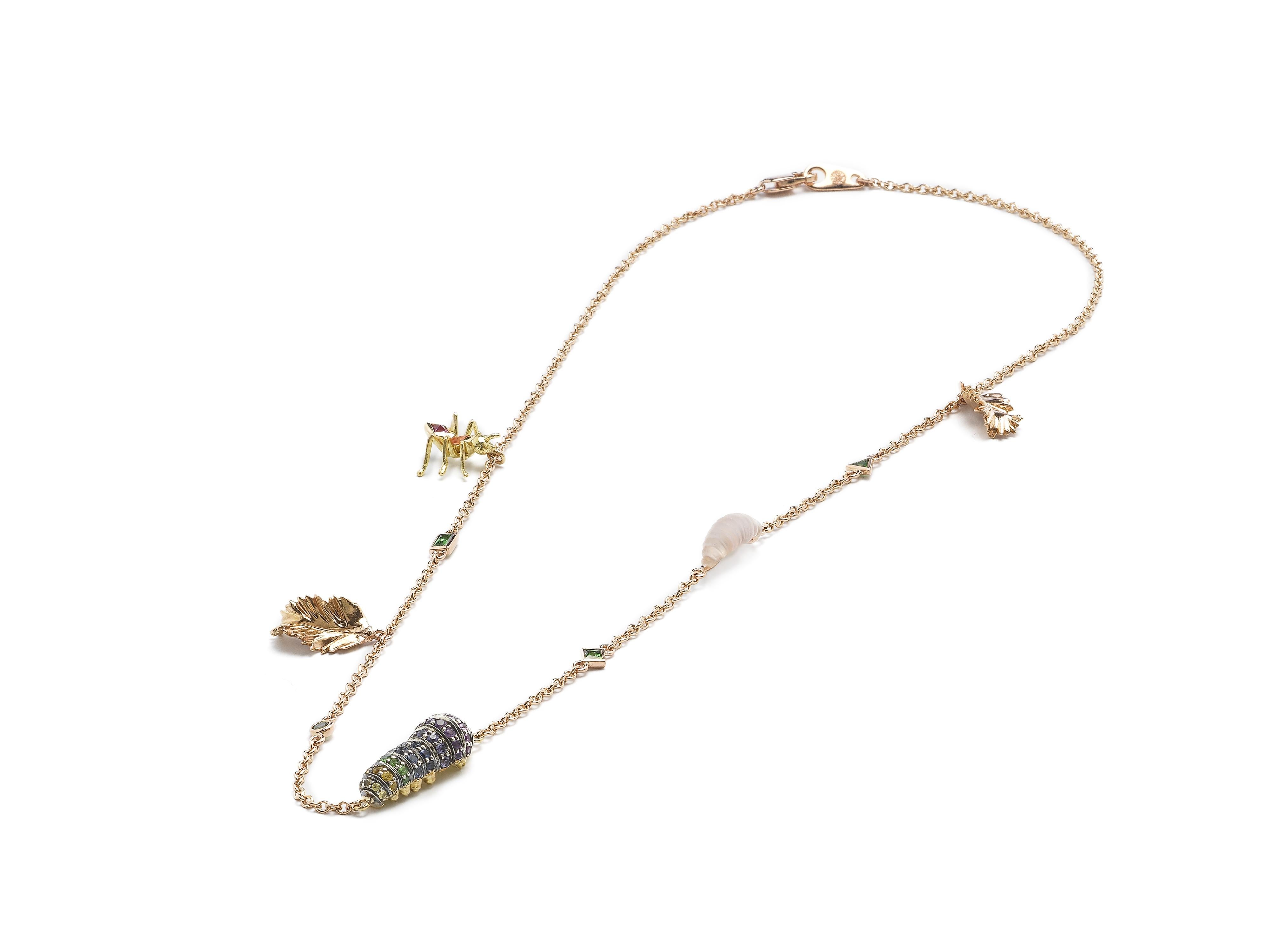 A multitude of captivating insects sit on this delicate chain, which is fashioned to drape on the collarbone. The chain is designed in 18k rose gold, and is set with an 18k yellow gold ant embellished with orange and hot pink sapphires; 18k rose