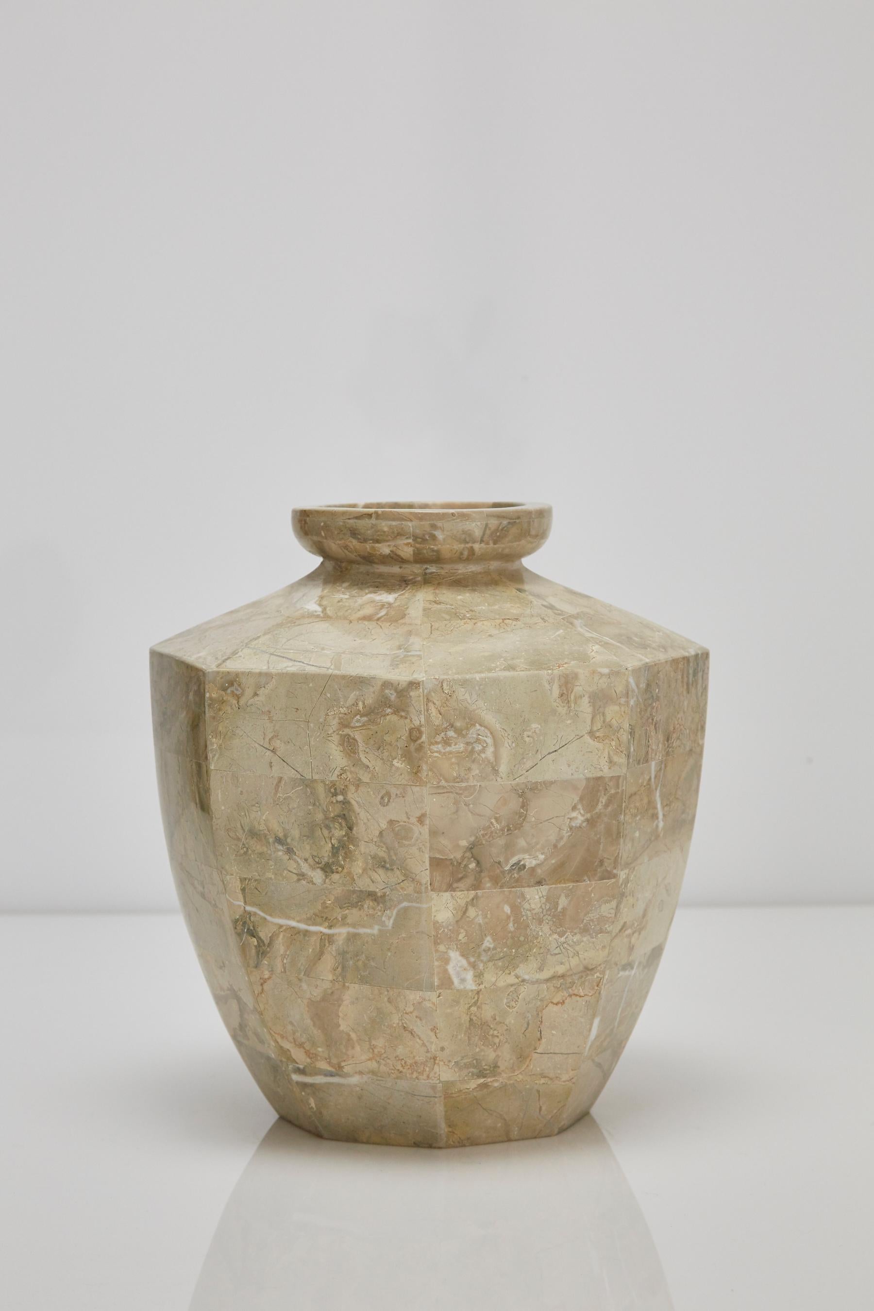 Short octagonal flower vase executed in tessellated cantor stone over a fiberglass body.

All furnishings are made from 100% natural Fossil Stone or Seashell inlay, carefully hand cut and crafted piece-by-piece and precisely inlaid to the form of