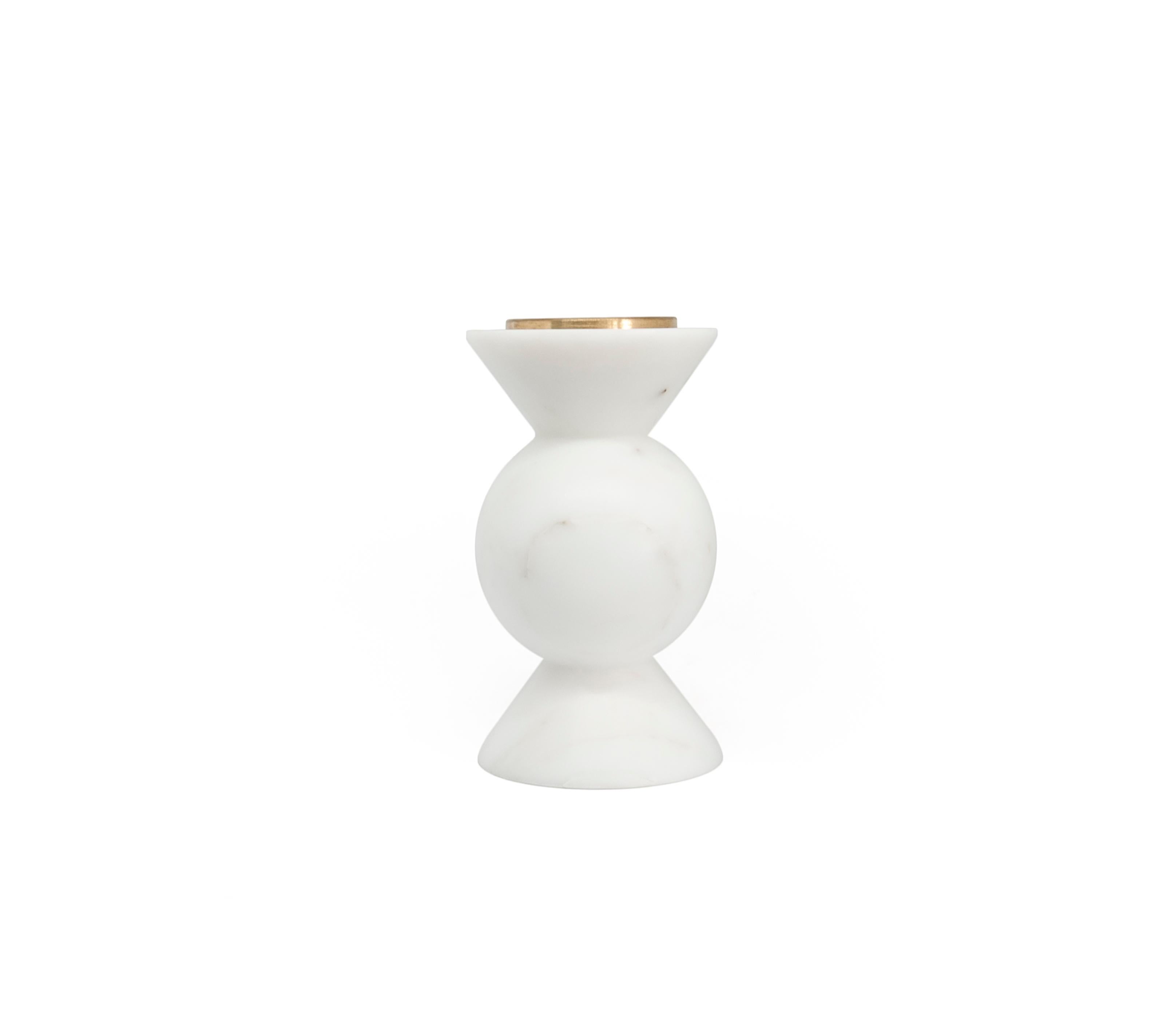 Short rounded unicolor candleholder in white Carrara marble and brass.
-Jacopo Simonetti design for FiammettaV-
Each piece is in a way unique (every marble block is different in veins and shades) and handmade by Italian artisans specialized over