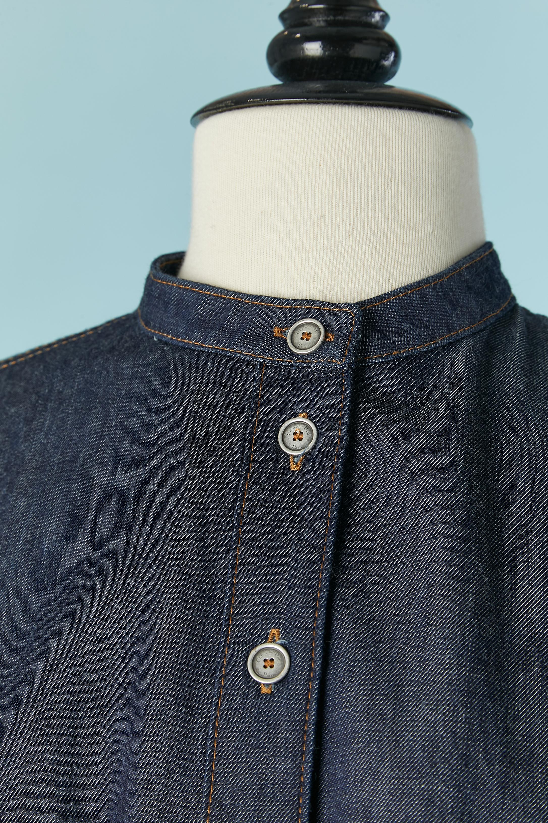 Short sleeve denim shirt dress with gather around the waist and adjustable drawstring closure waist. Branded button and buttonhole closure on the top middle front. 
SIZE on tag 36 ( Fr) but fit S and M 