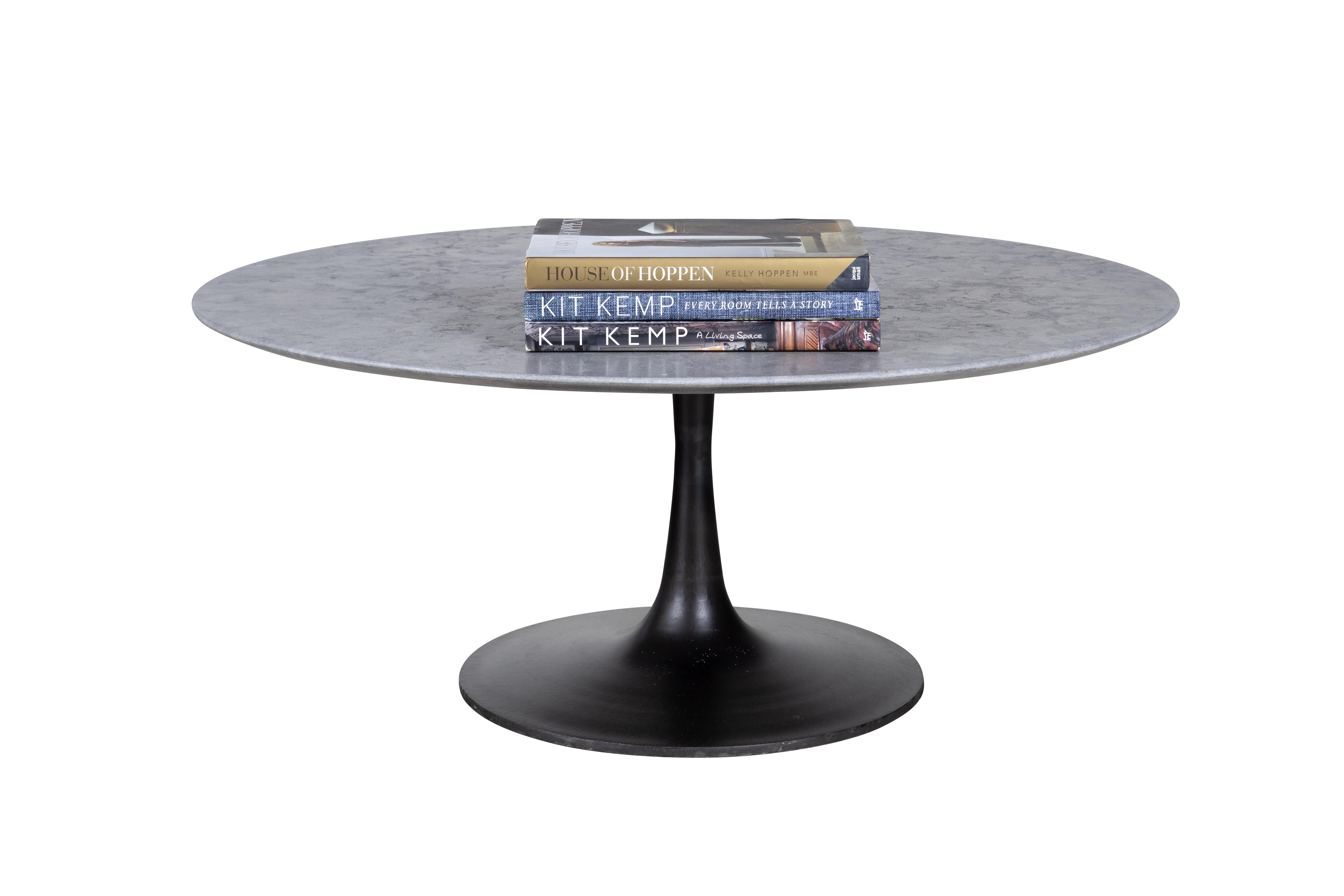 This beautiful coffee table is a part of Brendan Bass's one of a kind collection and is a favorite within the collection. This coffee table features an ebonized iron tulip base sourced from Europe paired with a rocas azul limestone top with shark