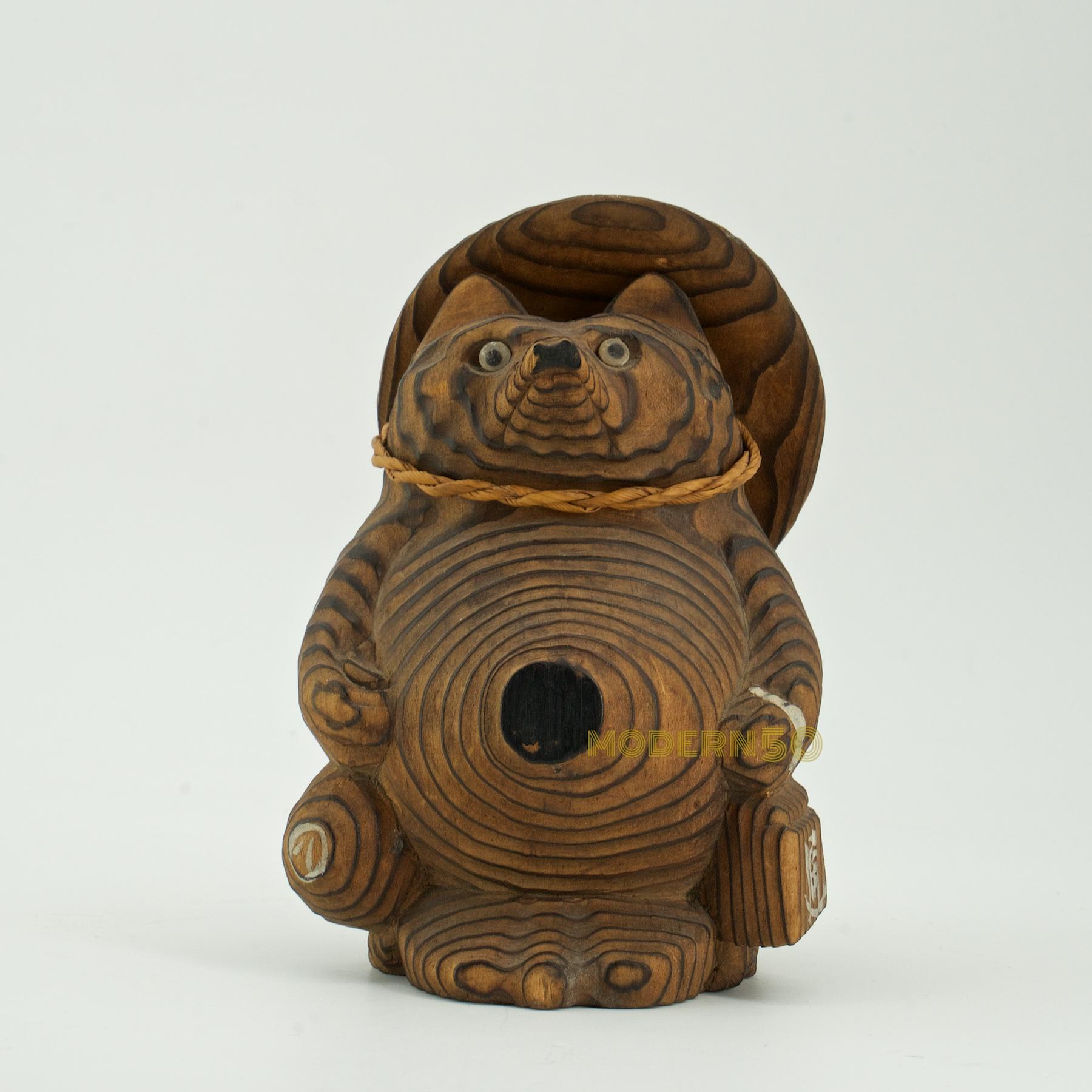 wooden tanuki statue