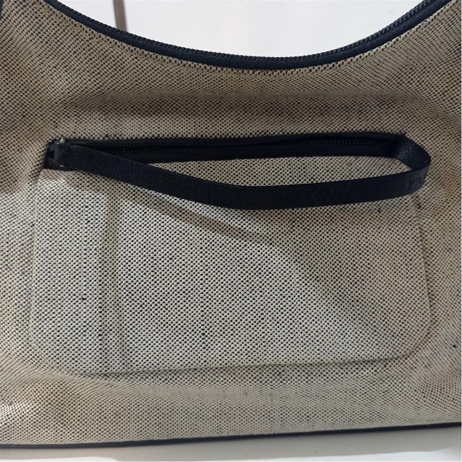 Canvas and leather Beige and black color Zip closure Front pocket with zip closure Zipped internal pocket Cm 28 x 22 x 10 (1102 x 866 x 393 inches)
