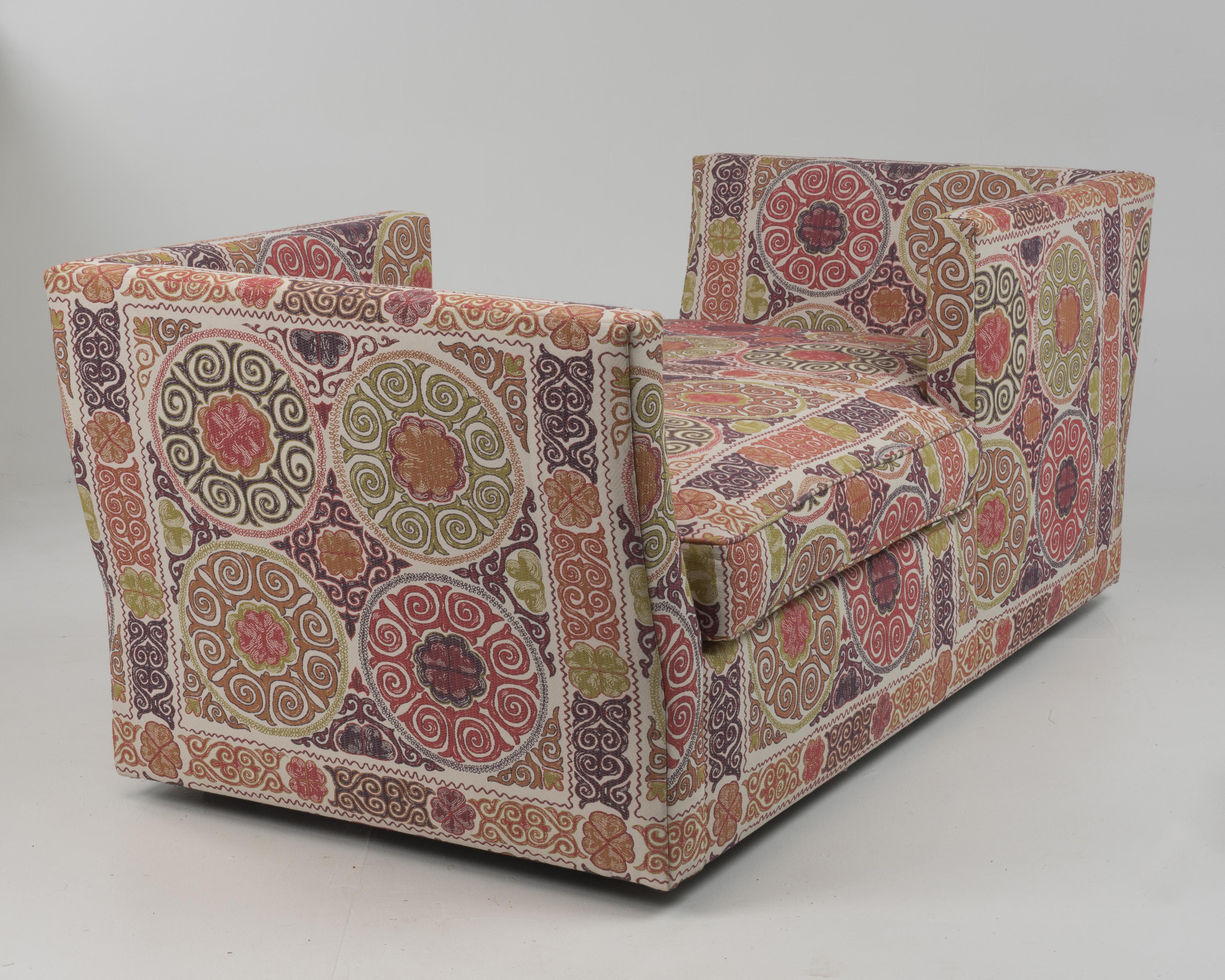 A show stopper focal point of a sofa, one of a kind, custom Tête-á-Tête in embroidered Suzani-style fabric. Would be fabulous floating in a large room, as it's incredible from every angle.
The side opening is 39”.
Arm height 36
Seat interior