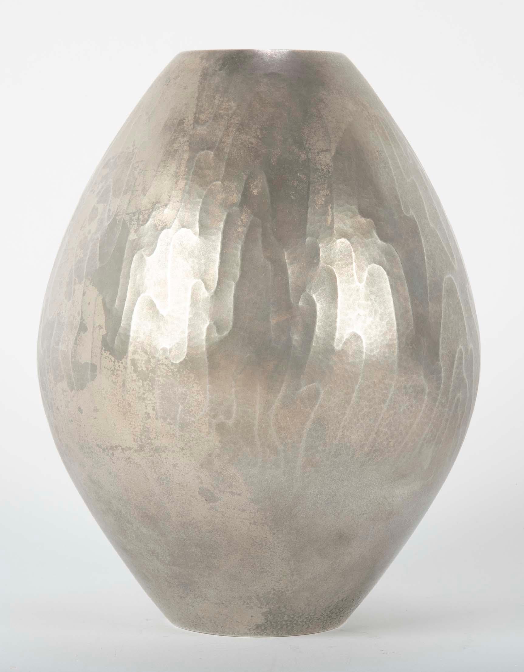 A high grade Japanese silver vase using heat treated silver as a form of decoration/patination. Chop mark of artist to base, circa 1965.