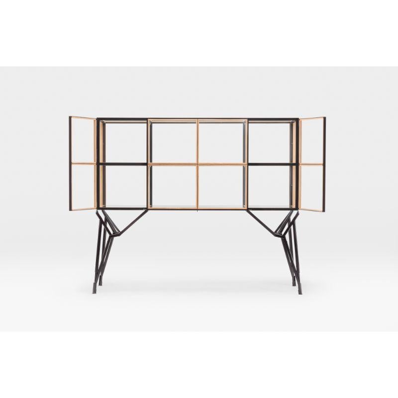 Showcase Cabinet, 4x2 by Paul Heijnen (2011)
Dimensions: H131 x L160 x W50 cm
Materials: Steel, Oak, Glass

Available in different varieties/stains,

Each cabinet is made to order and as such size, colour & materials are fully customisable;