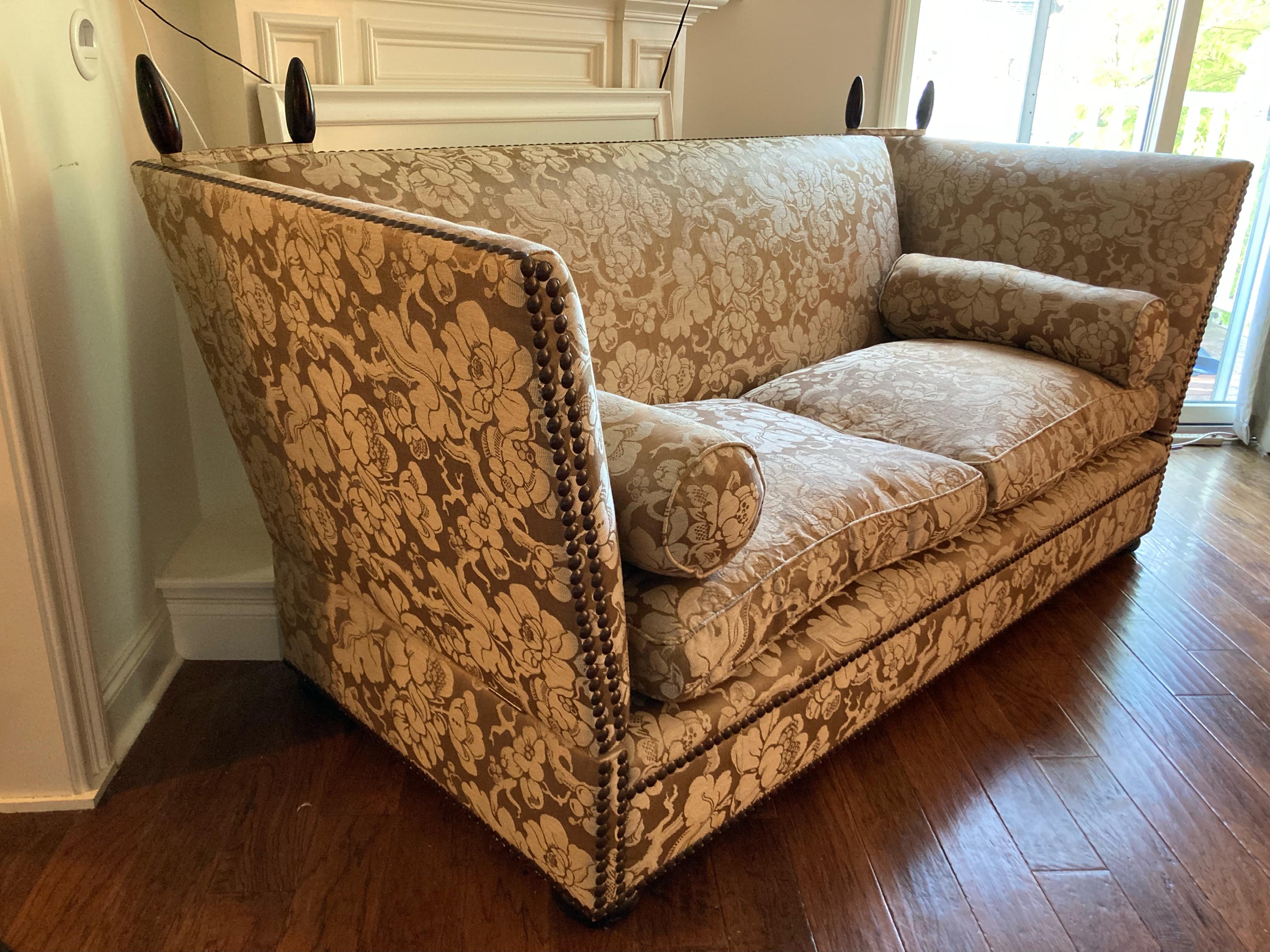 Large sumptuous George Smith custom knole style sofa with collapsible sides, mahogany finials, and down filled seat cushion. Japonais sable fabric shows wear  on seat cushions so customer may opt to reupholster seat covers.  
With sides extended