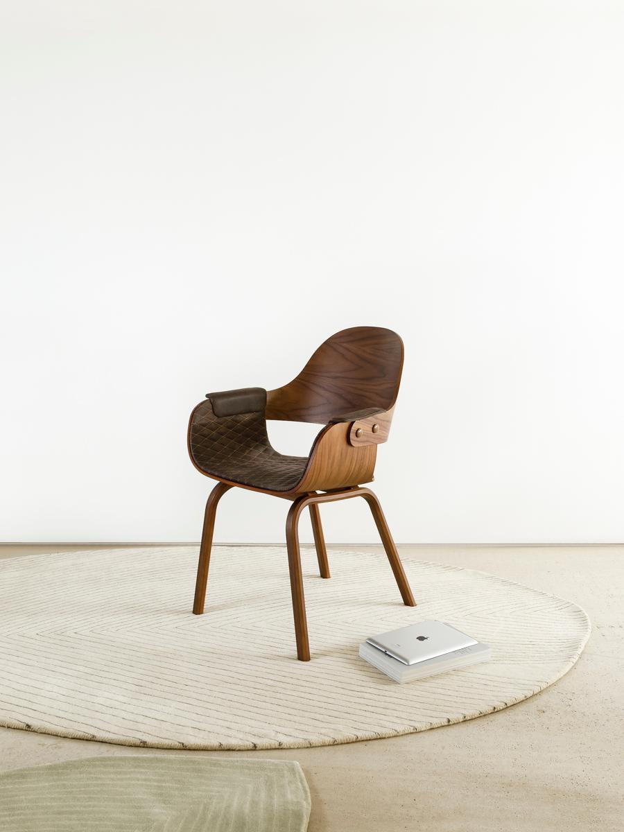 Modern 4 leg chair in walnut and upholstered in leather