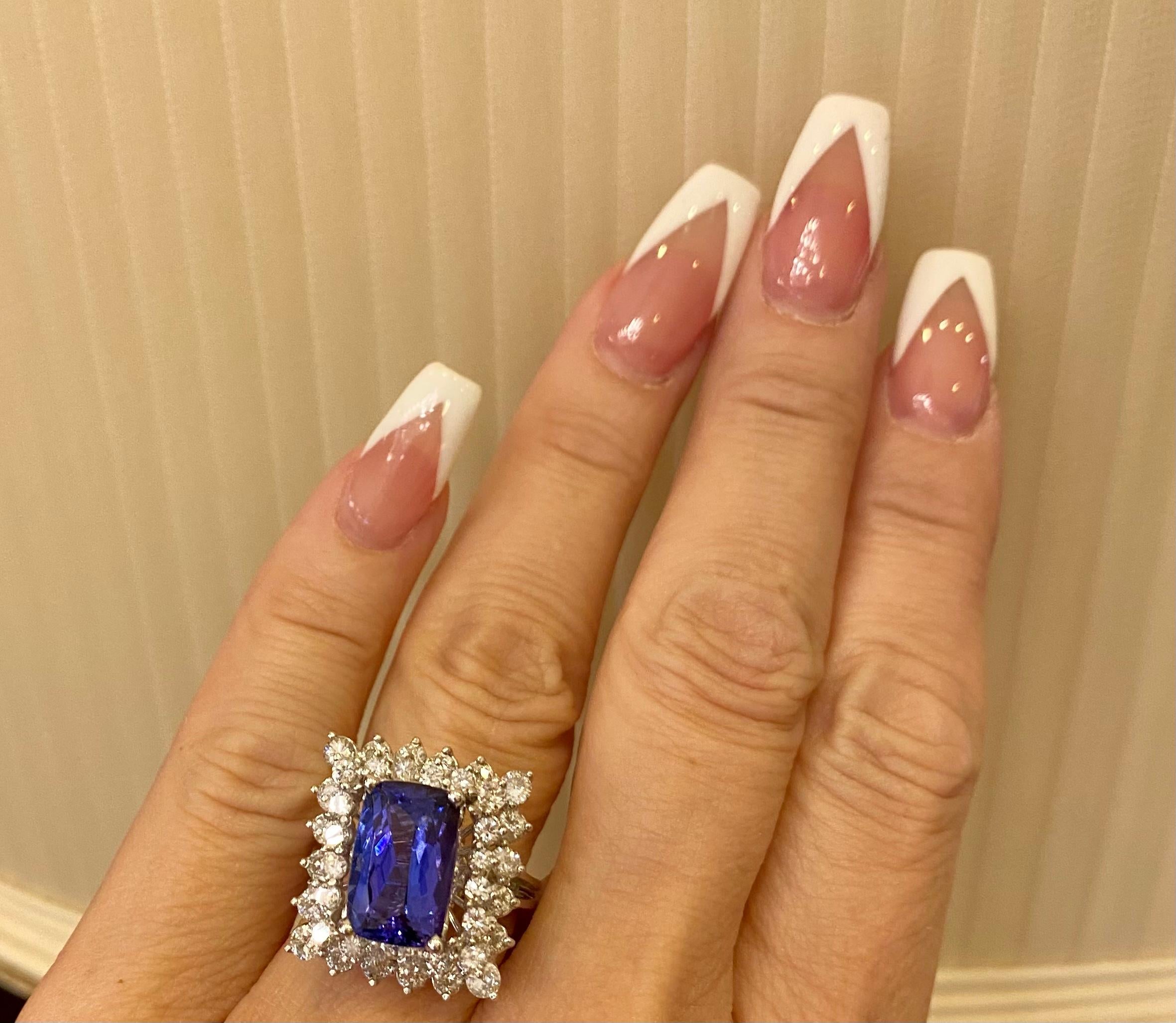 Showy 10.5 Carat Vivid Tanzanite Double Diamond Halo White Gold Cocktail Ring For Sale 1