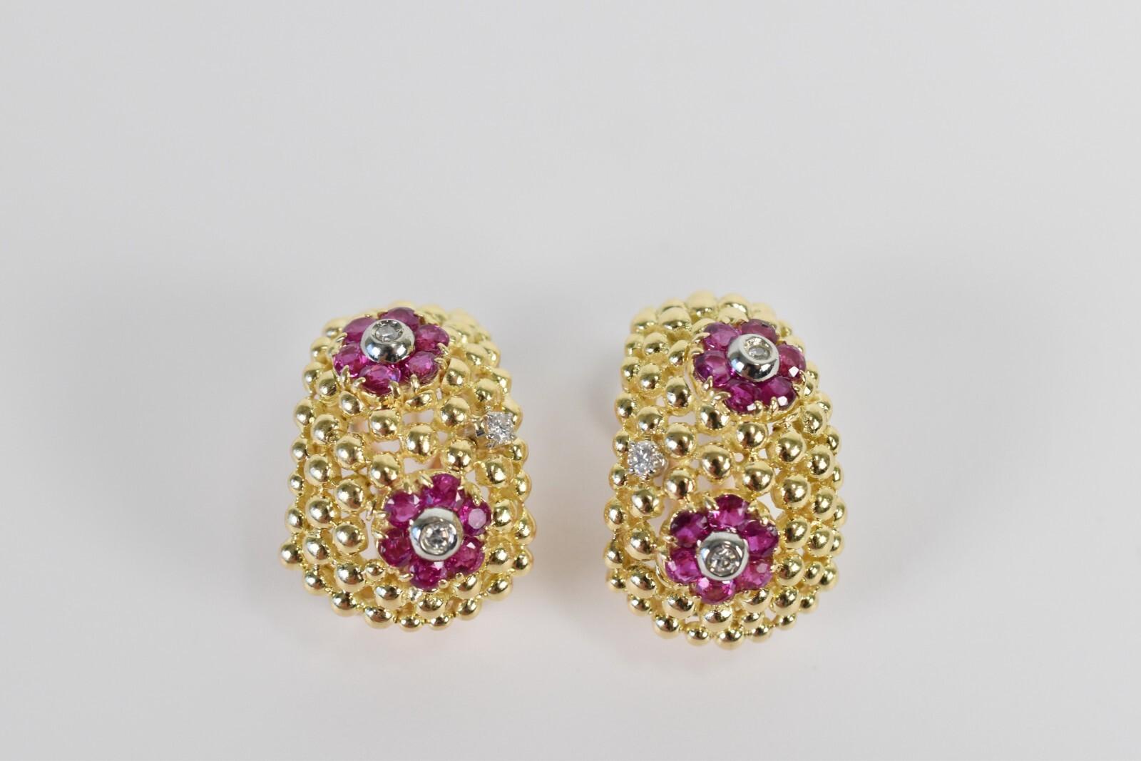 These striking 18k tri-gold earrings by Shreve & Co. are a bold yet elegant statement of vintage luxury. Crafted in rich yellow gold, the domed surface features a textured matrix of polished beads, creating a dimensional backdrop for floral clusters