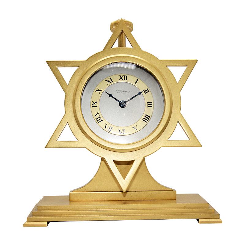 FACTORY / HOUSE: Shreve & Co.
STYLE / REFERENCE: Art Deco / 6 Pointed Star
METAL / MATERIAL: Gilded Bronze 
CIRCA / YEAR: 1940's
DIMENSIONS / SIZE: 6 Inches Tall x 4 inches wide
MOVEMENT / CALIBER: Manual Winding / 7 Jewels 
DIAL / HANDS: Double