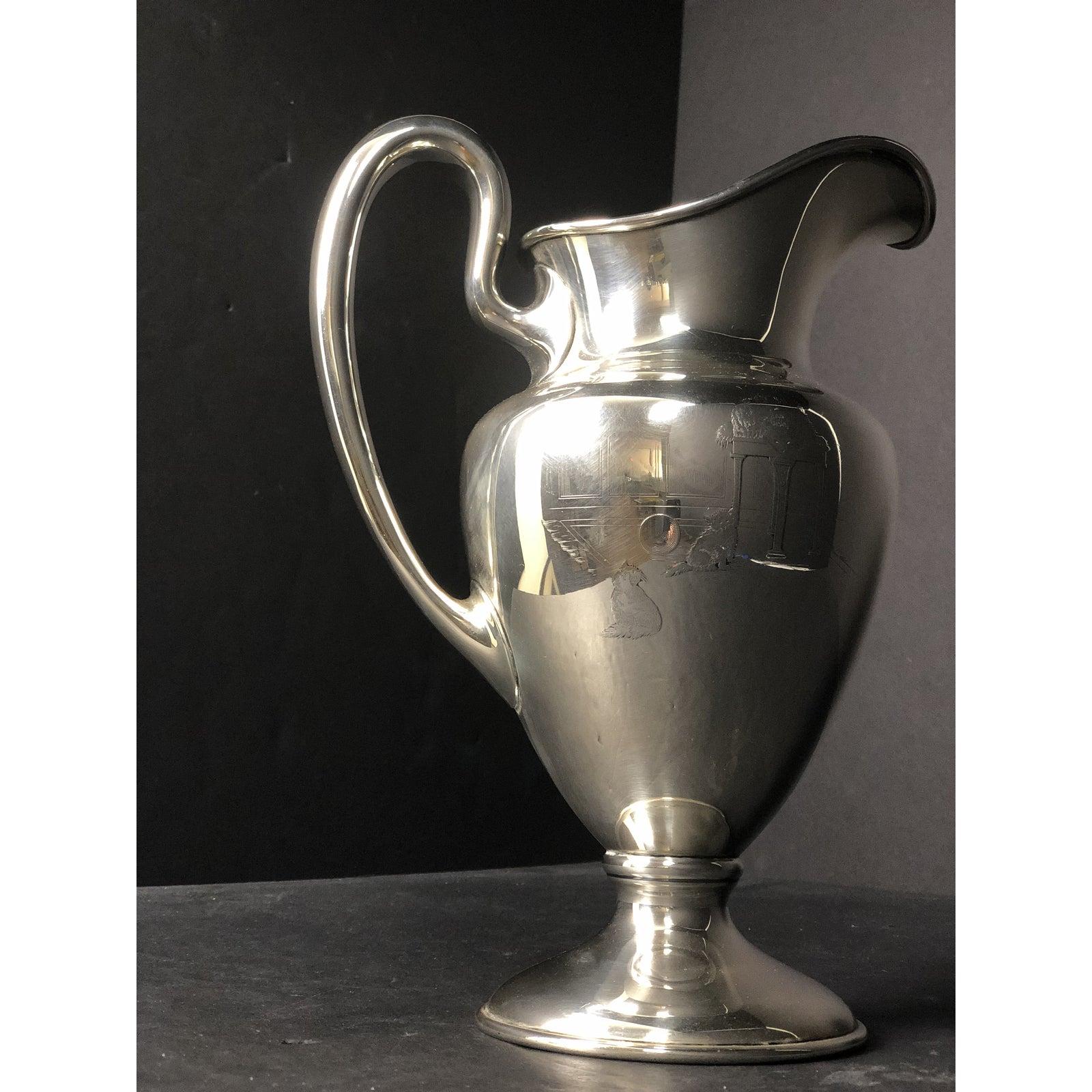 Large sterling silver pictorial water pitcher by Shreve & Co. Artist engraved and decorated large 5 1/2 pint sterling silver pitcher. Unique Shreve & Co. San Francisco. 5 1/2 pint sterling silver pitcher with artist designed raised and engraving