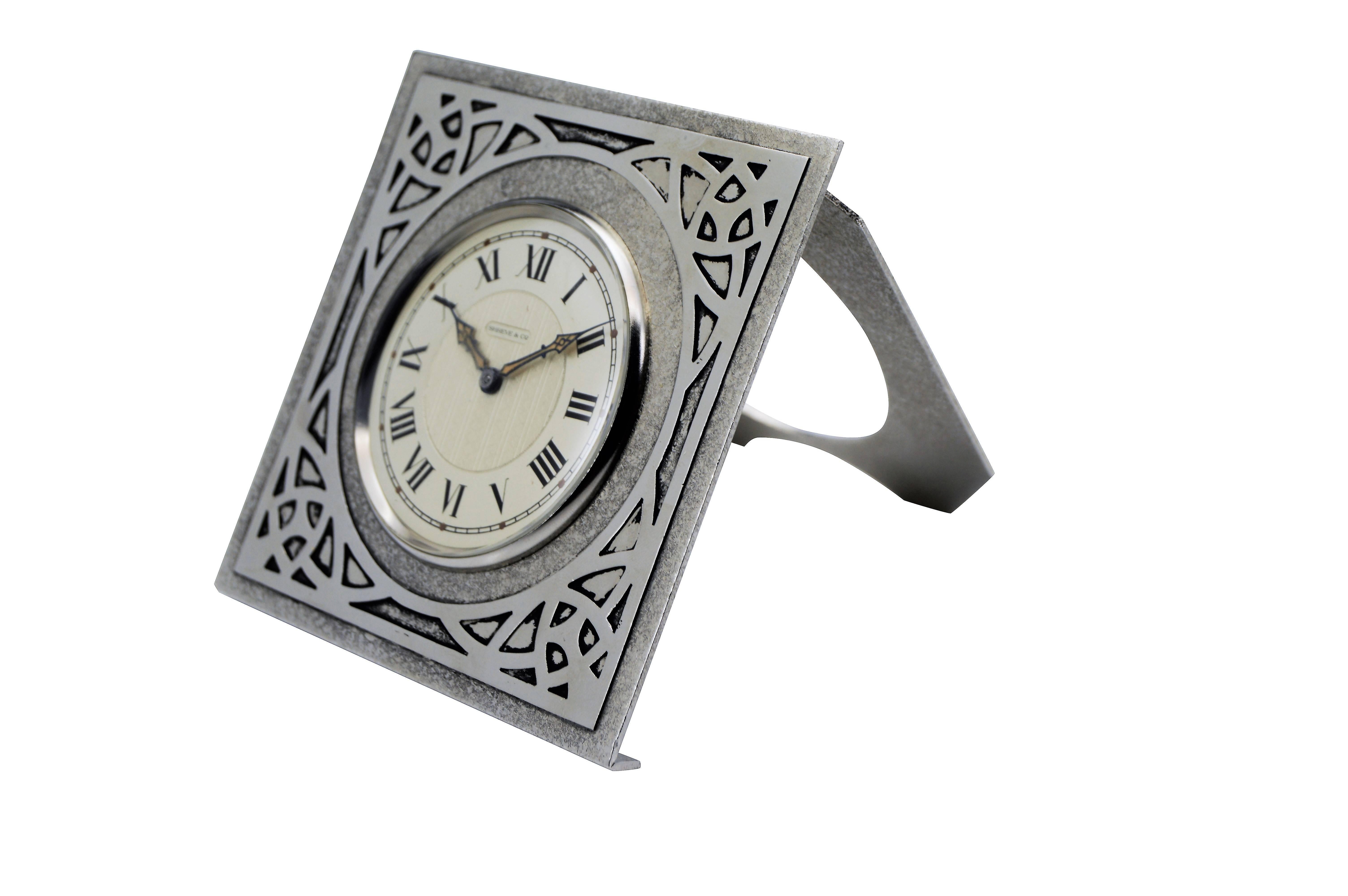 FACTORY / HOUSE: Shreve & Co.
STYLE / REFERENCE: Arts and Crafts Desk Clock
MOVEMENT / CALIBER: 8 Day
DIAL / HANDS: Silvered with Blued Steel Luminous Hands
DIMENSIONS: 4 Inches X 4 Inches
WARRANTY: 18 months on the movement.

LIFETIME SERVICE