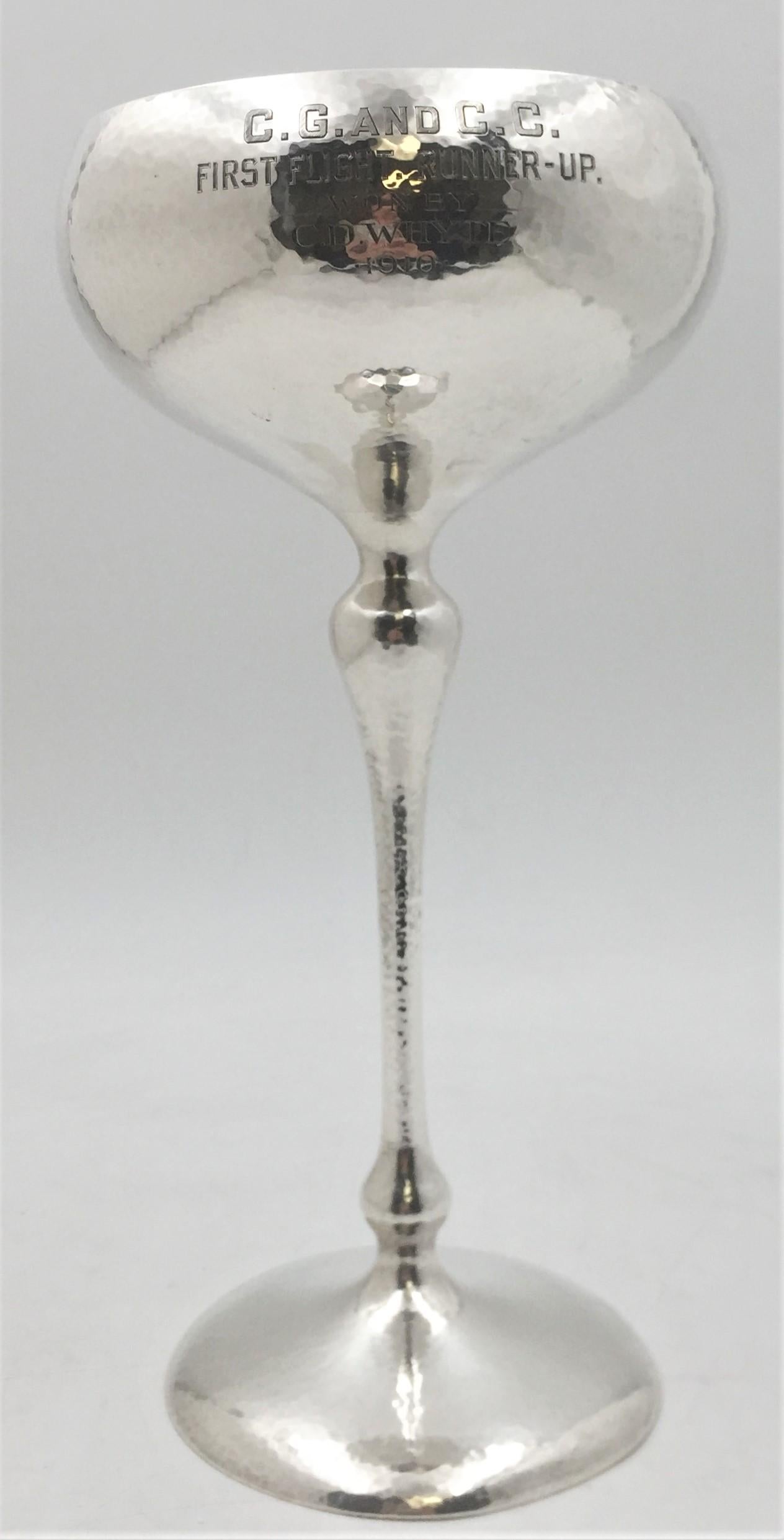 Shreve & Co. large sterling silver goblet / trophy with a tall stem, designed with a hand hammered finish in exquisite Art Deco style. It measures 11.5 inches tall and 5.3 inches wide at top, weighs 20 troy ounces (gross weight; loaded base), and