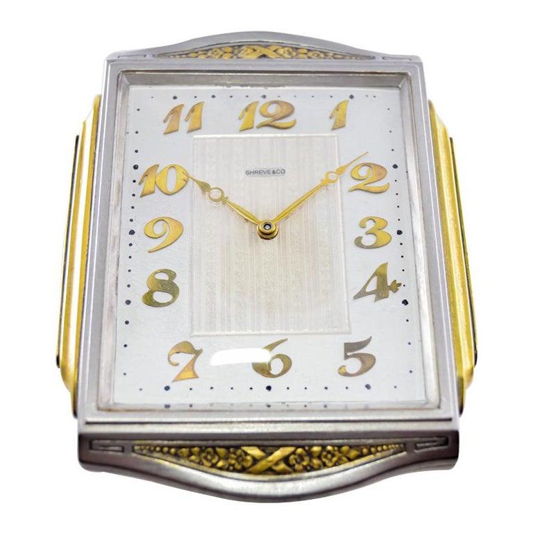 FACTORY / HOUSE: Shreve & Co. 
STYLE / REFERENCE: Table Clock
METAL / MATERIAL: Nickle Brass Gilded Metal
CIRCA / YEAR: 1930's
DIMENTIONS / SIZE: 5 x 4
MOVEMENT / CALIBER: Manual Winding / 15 Jewels / 8 Days
DIAL / HANDS: Silvered Dial with Applied