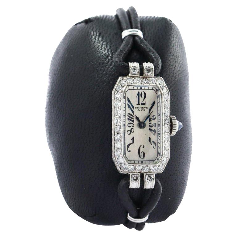 FACTORY / HOUSE: Shreve & Co
STYLE / REFERENCE: Art Deco Diamond Dress Watch
METAL / MATERIAL: Platinum
CIRCA / YEAR: 1920's
DIMENSIONS / SIZE: Length 30mm X Width 14mm
MOVEMENT / CALIBER: Manual Winding / 17 Jewels / Caliber High Grade  
DIAL /