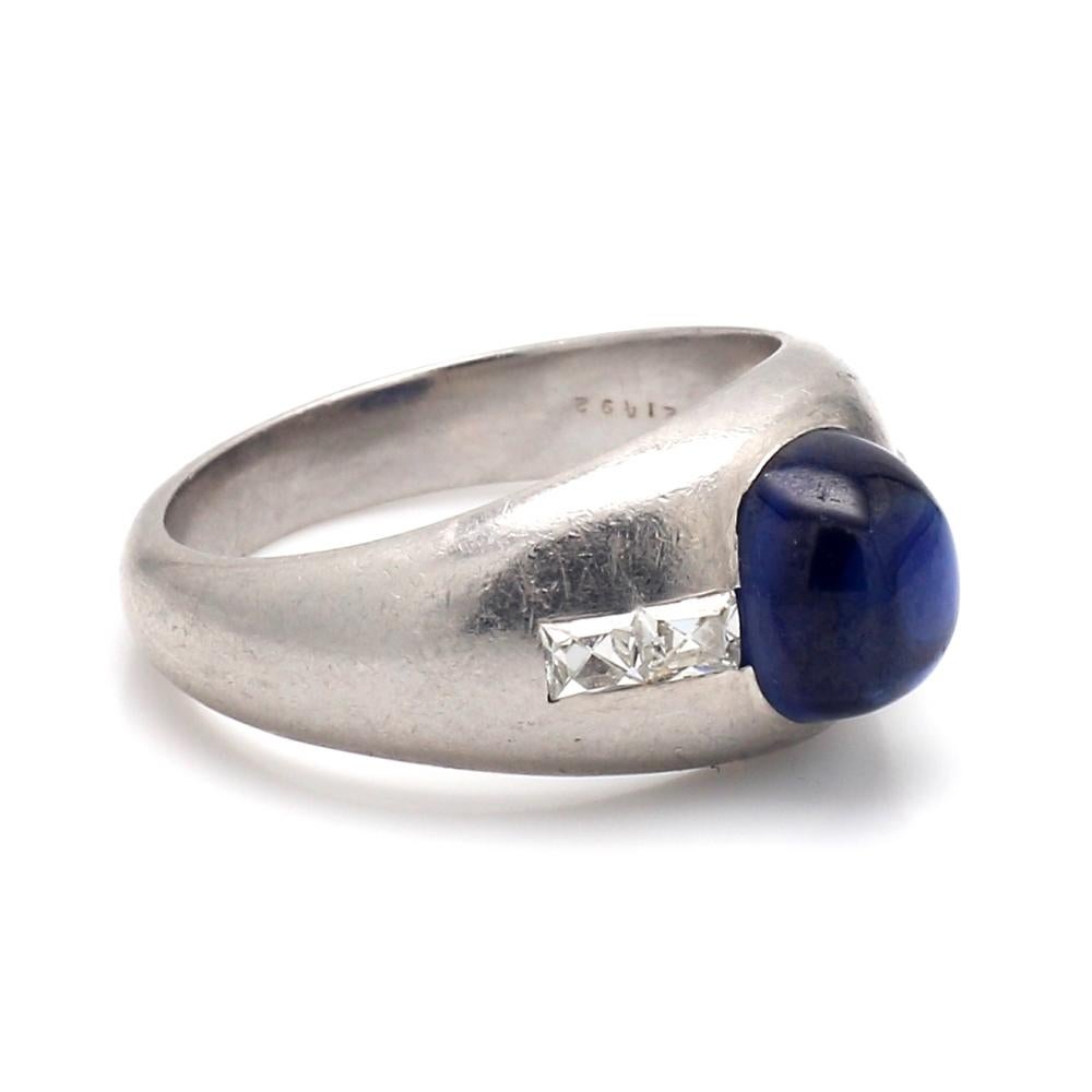 Shreve & Co., sapphire and diamond, platinum ring. Center stone is one (1) oval, cabochon cut, no heat sapphire weighing approximately 3.47ct. Sapphire is accompanied by GIA Lab Report #5212584309. Sapphire is flanked by four ( 4 ) French cut